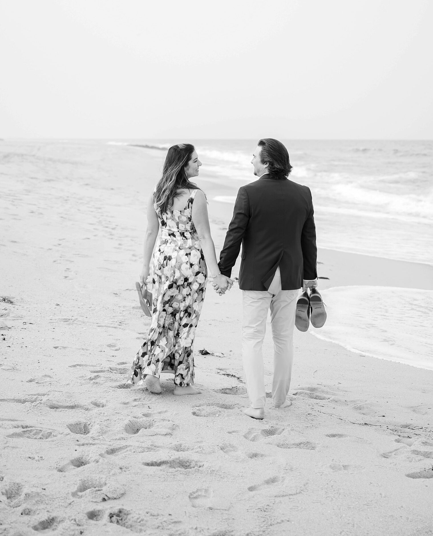 Couple walking through the beach in Sea Bright