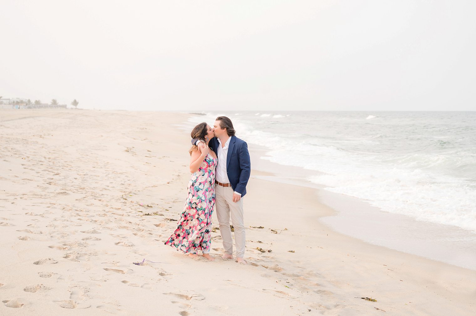Couple kissing during engagement session at Sea Bright