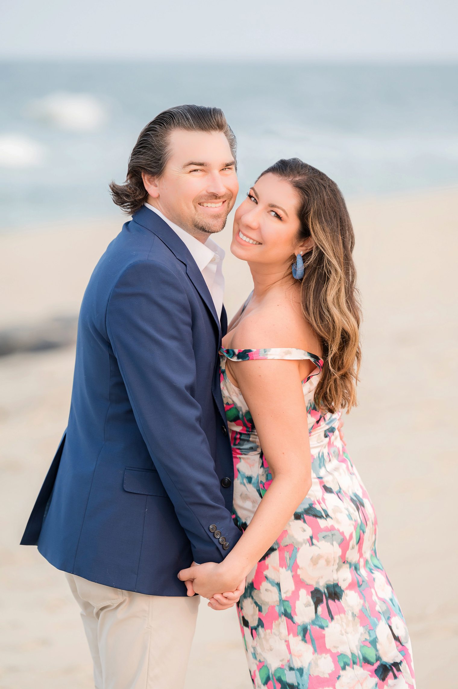 Future Husband and Wife happy at their beach engagement session