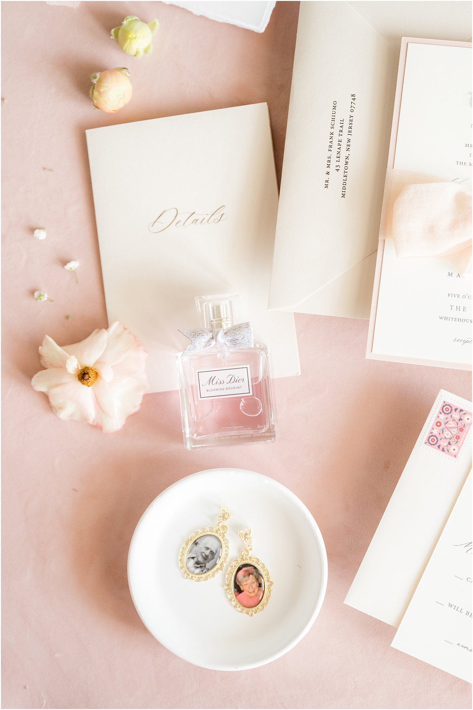 bride's perfume with vow booklet and invitation suite 