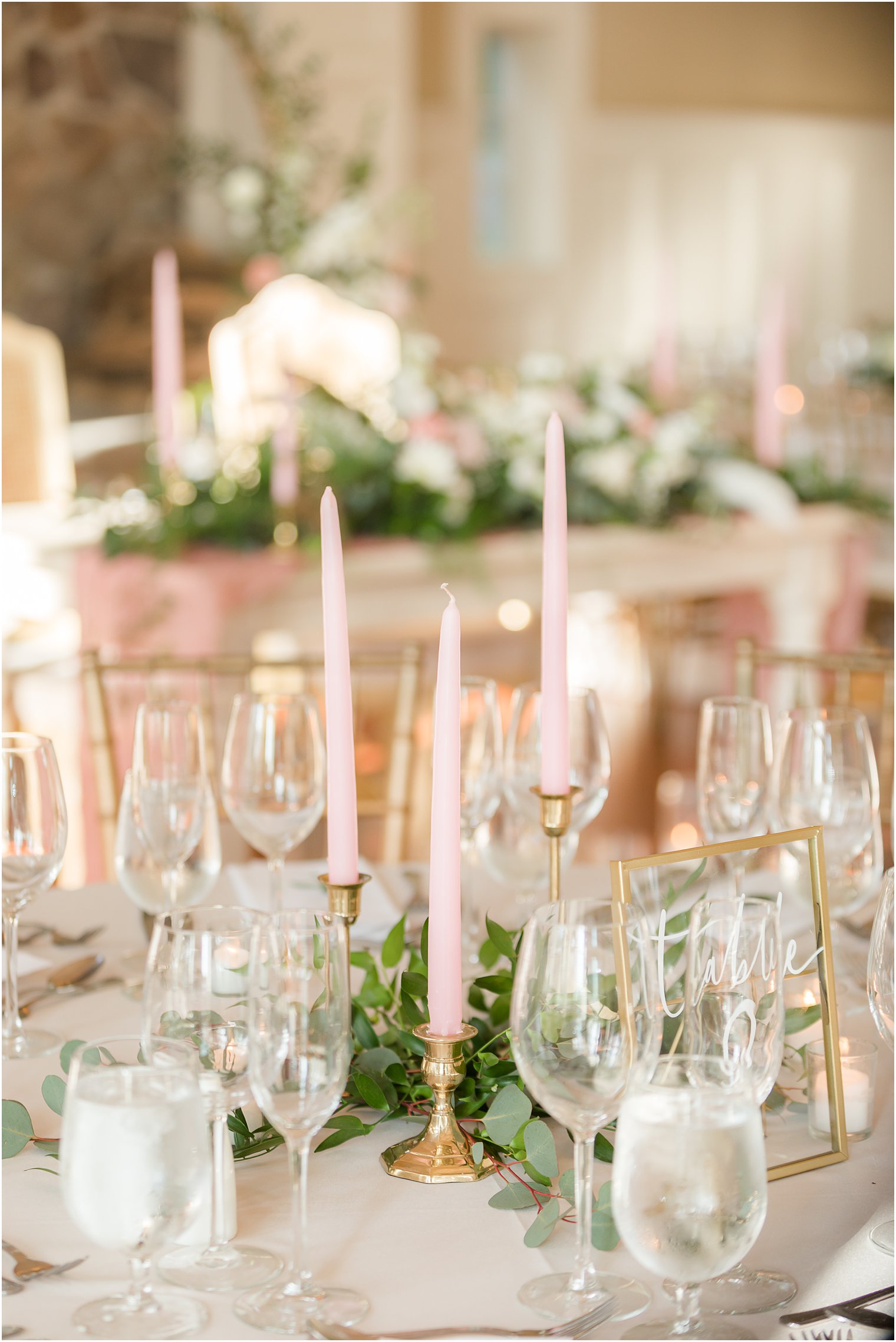 pink taper candles on table during Ryland Inn wedding reception