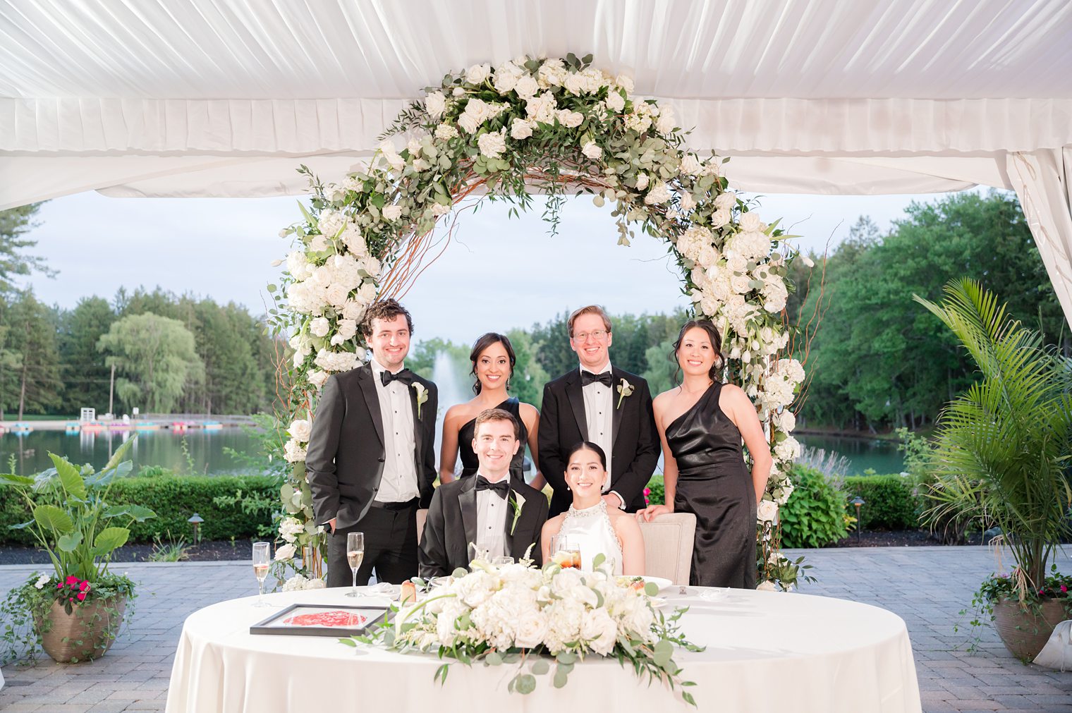 Married couple with some of their guest in their sweetheart table