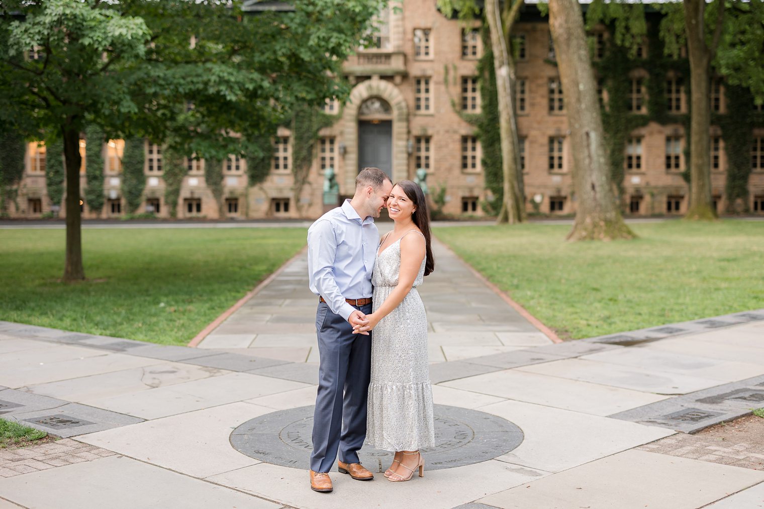 future husband putting his face in his future wife face at Princeton New Jersey in their engagement session