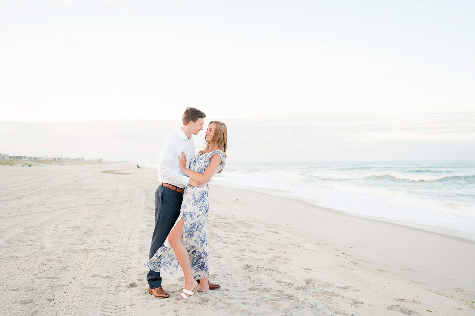 couple being romantic at their engagement session at Lavalette NJ