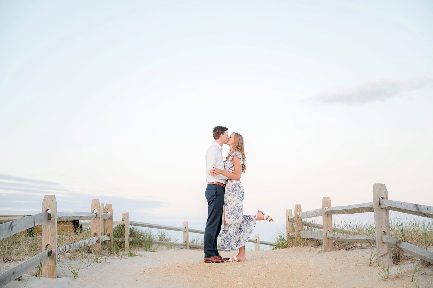 engaged couple kissing at their engagement session 