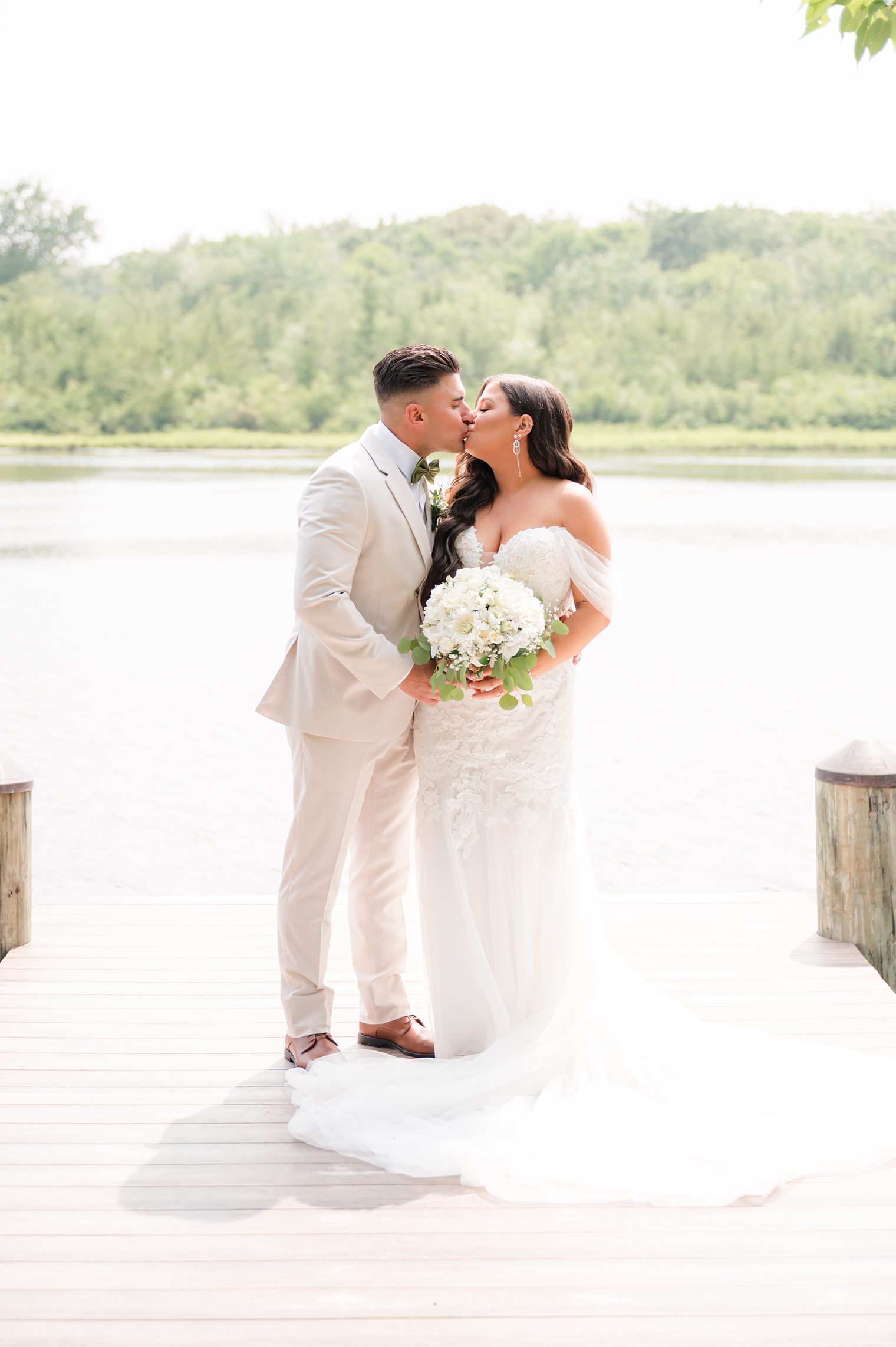 Couple kissing after their first look at The Mill Lakeside Manor 