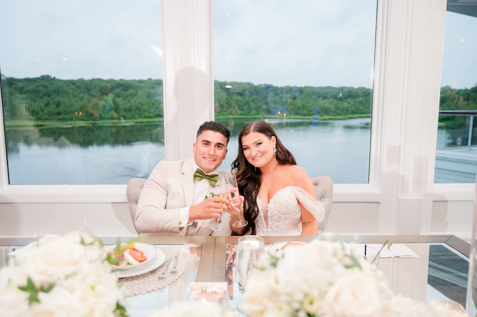 married couple at their sweet heart table at The Mill Lakeside Manor