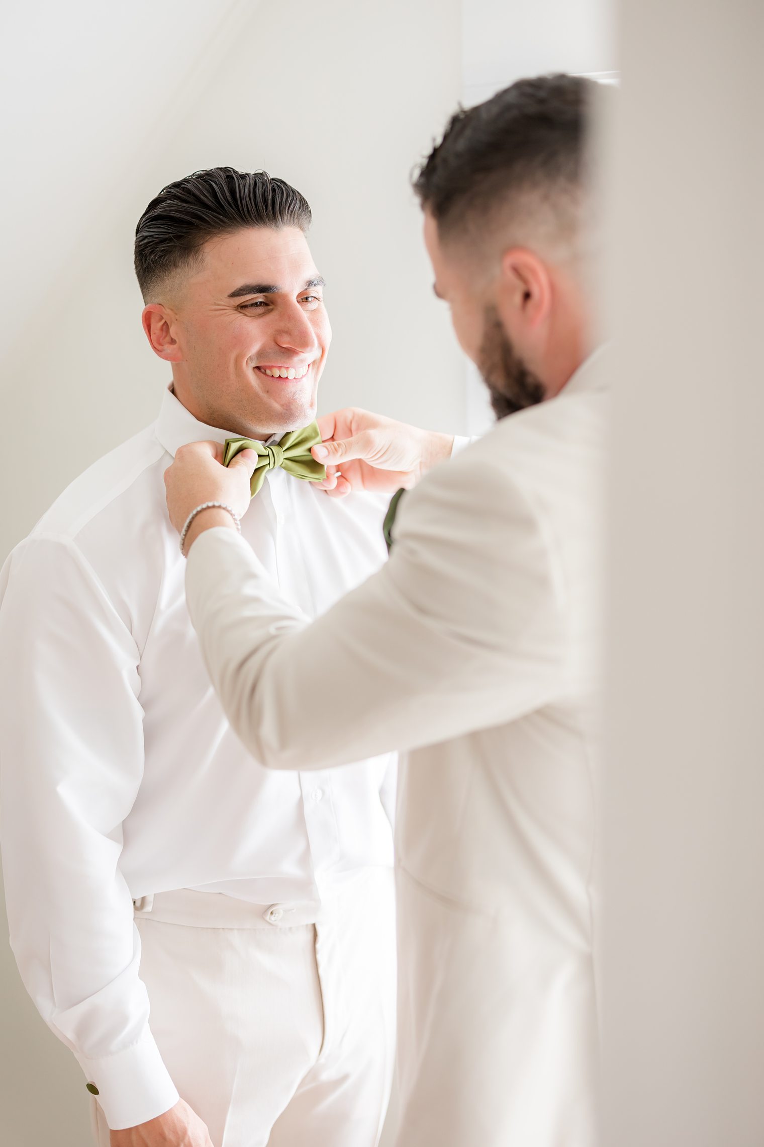 Groom getting ready with one of the best man
