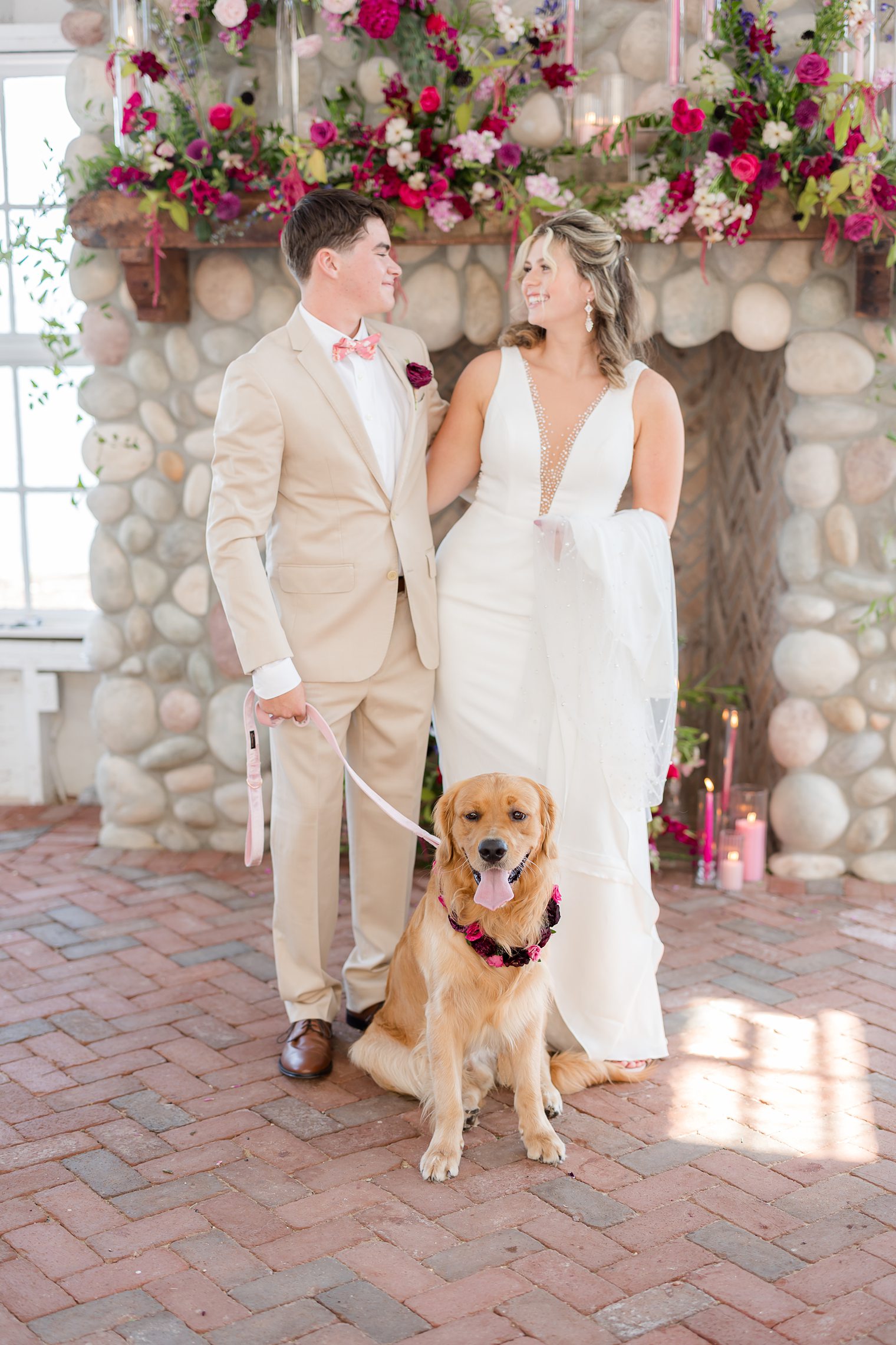 couple with their furry friend at Mallard Island Yacht Club 