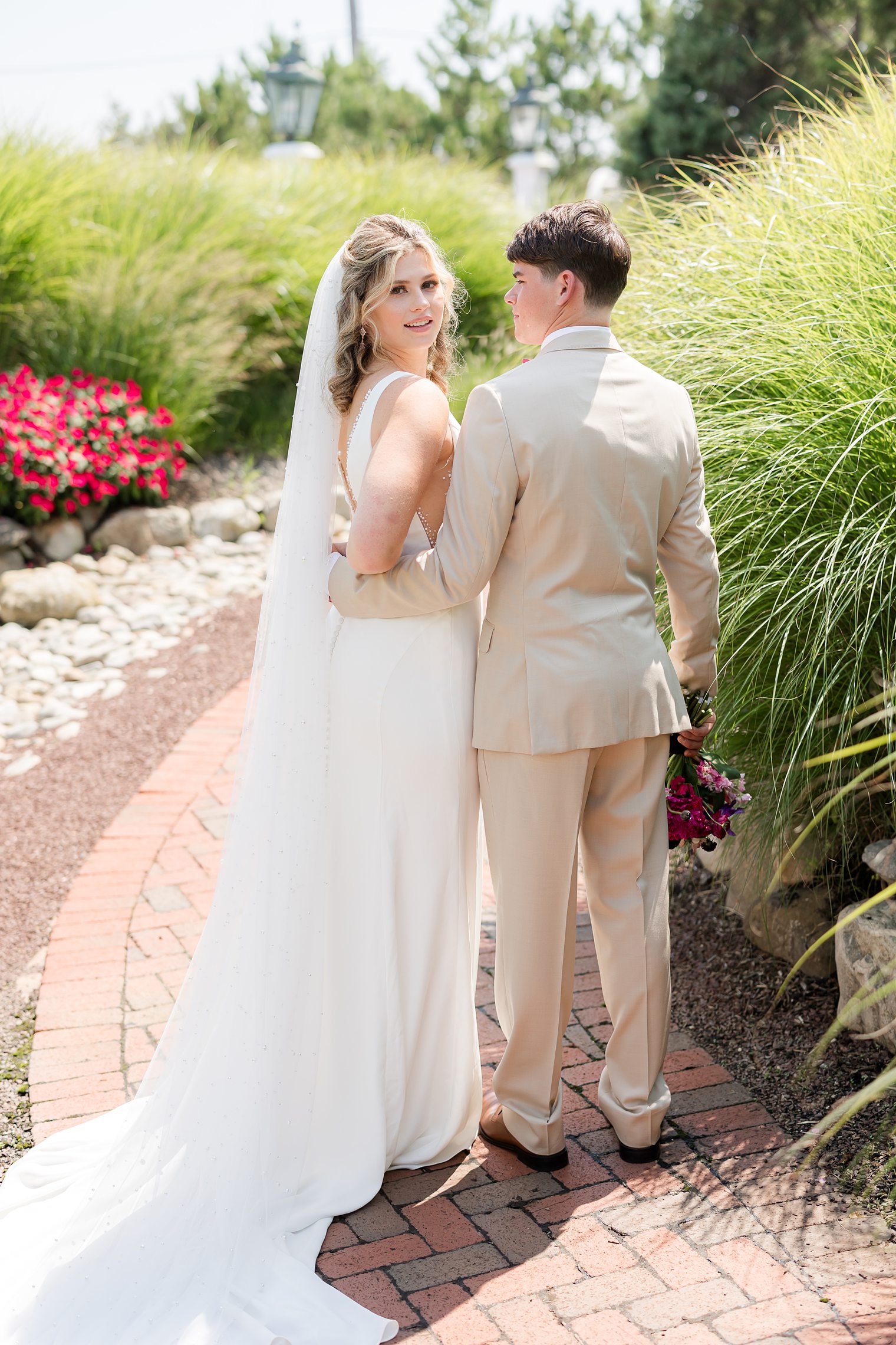 couple posing for their wedding session at Mallard Island Yacht Club 