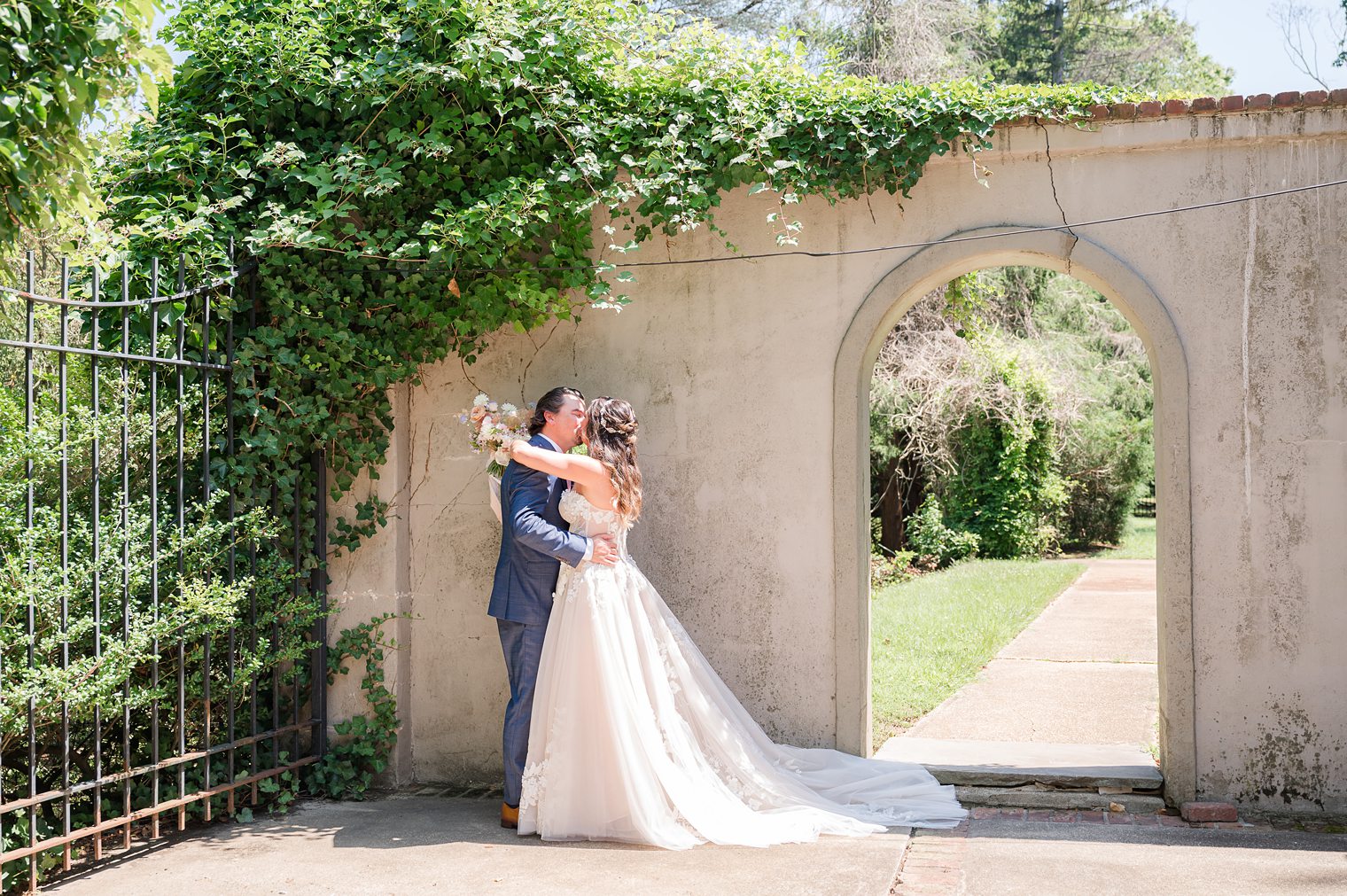 Couple kissing after their first look Riverhouse at Rumson Country Club