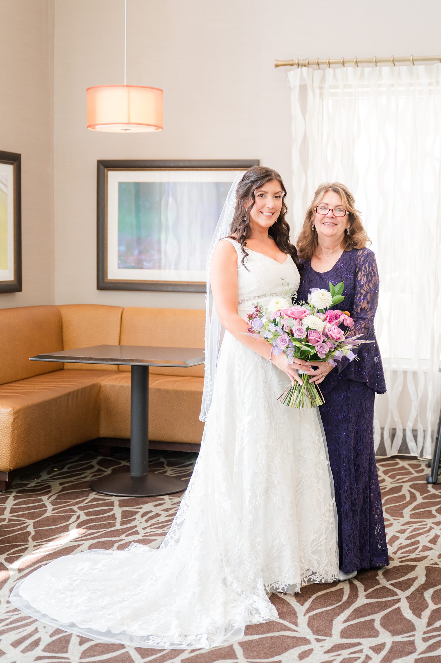 Bride happily with her mother in her big day at Windows on the Water at Frogbridge