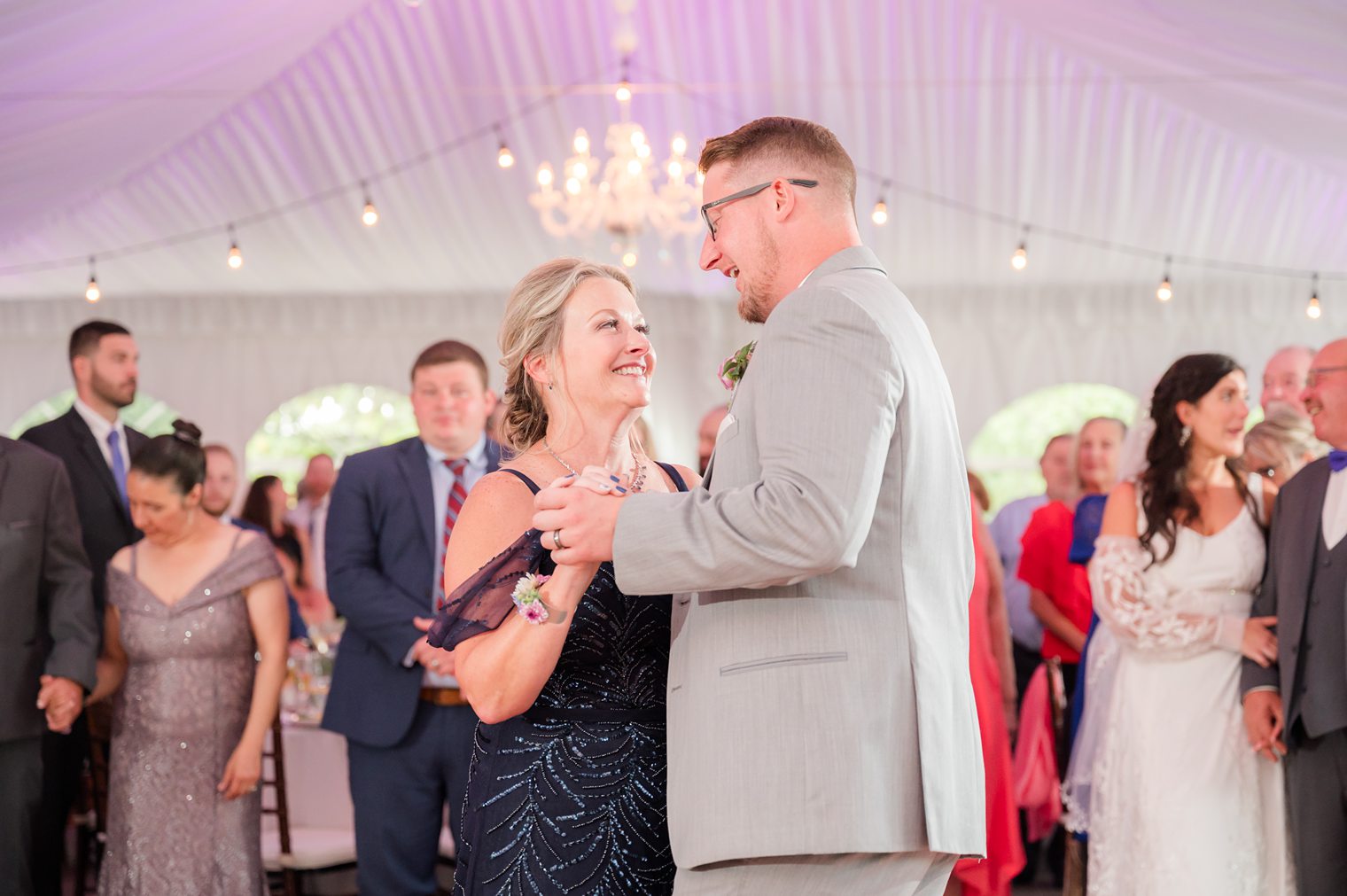 Groom dancing with his mother for the first time as a Mr at Windows on the Water Frogbridge