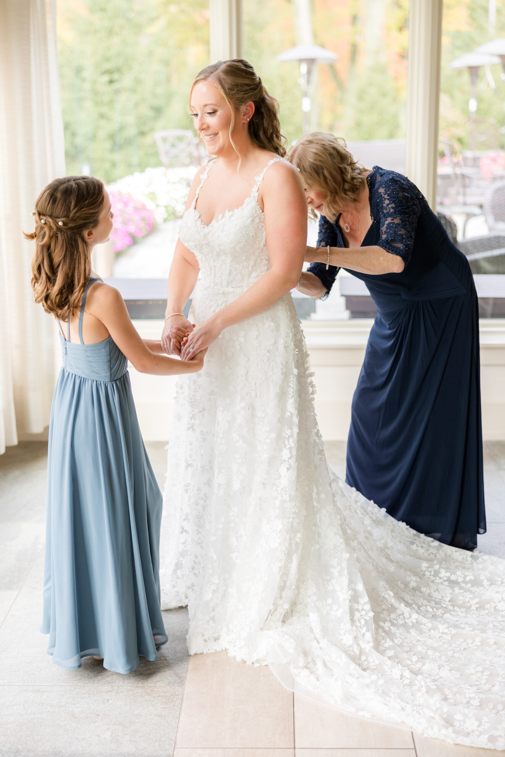 Bride getting ready with her daughter and mom 