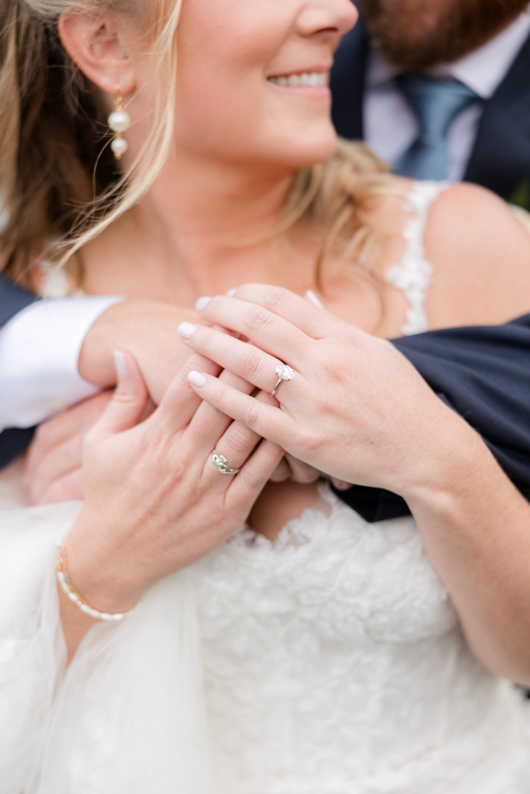 details of the couple holding hands
