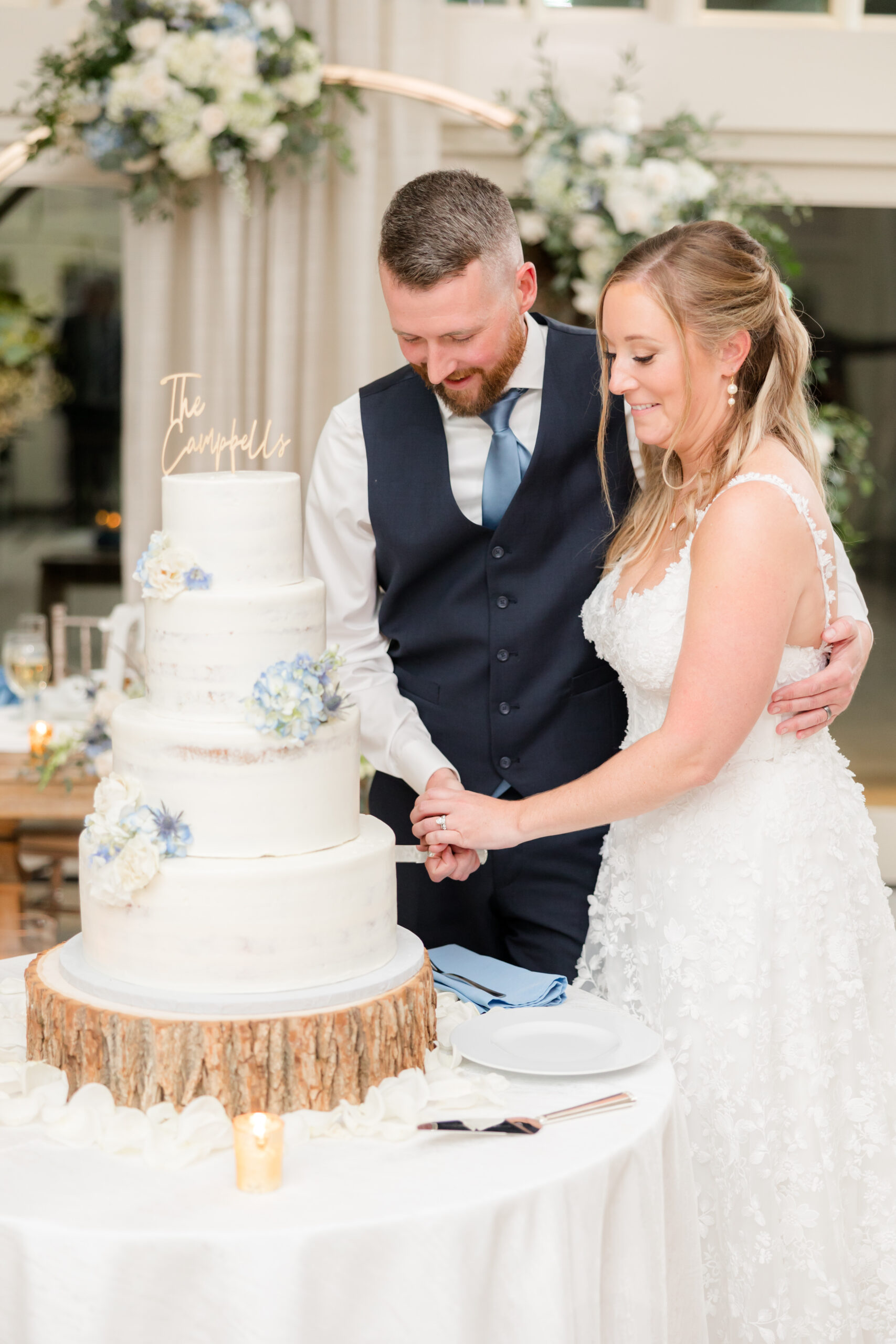husband and wife cutting their wedding cake 