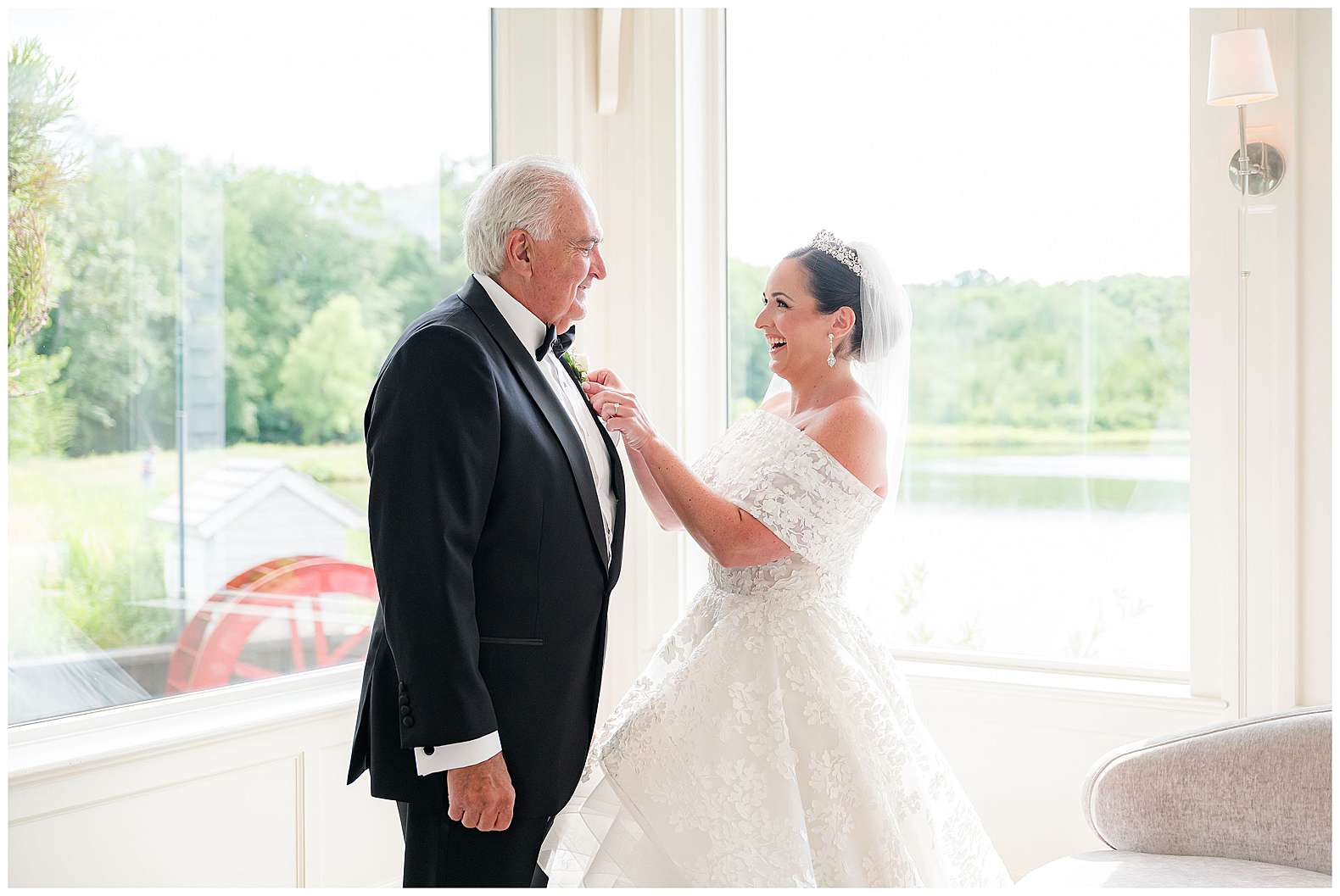 bride putting on father's boutonniere at The Mill Lakeside Manor