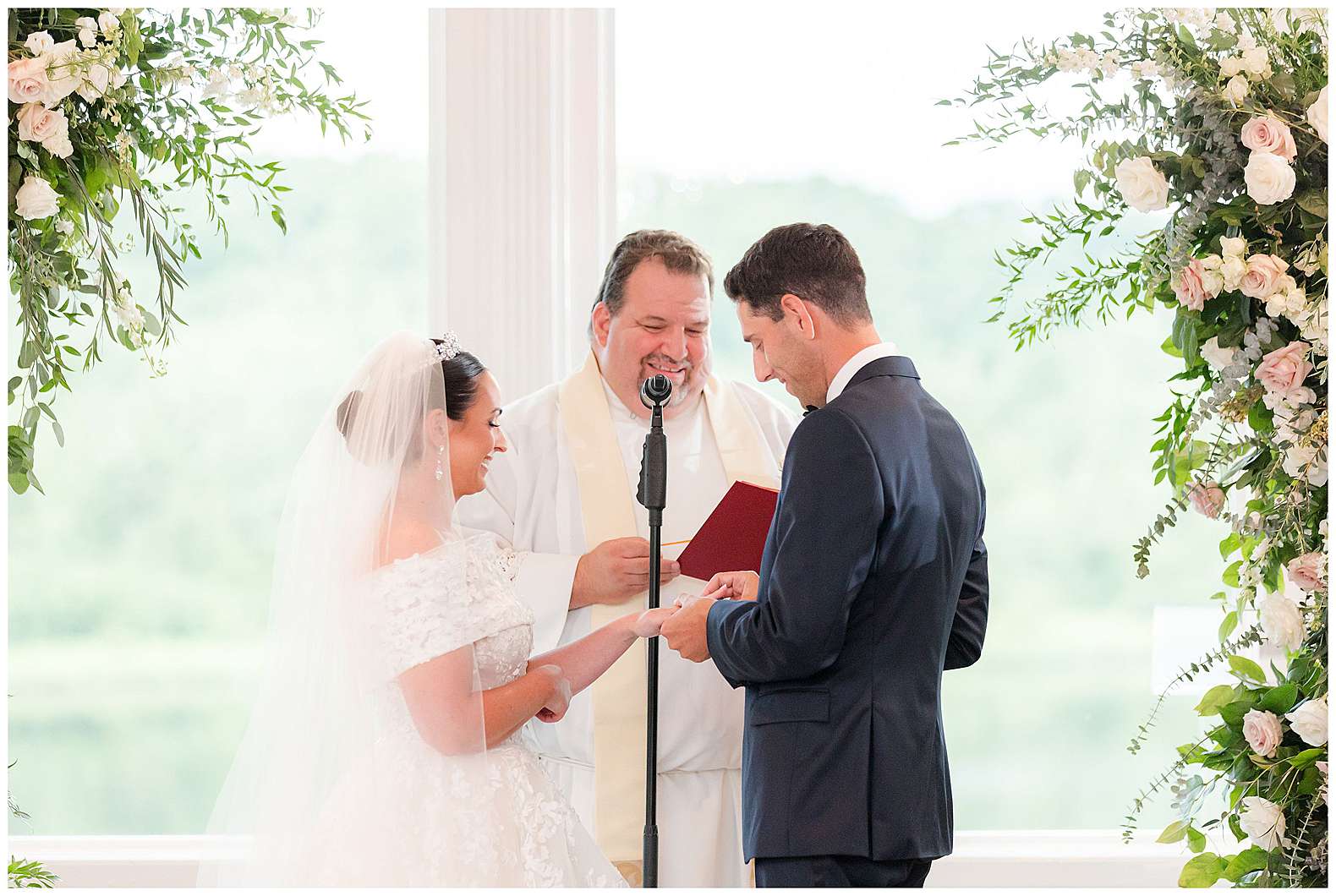 ring exchange during indoor ceremony at The Mill Lakeside Manor in Spring Lake, NJ