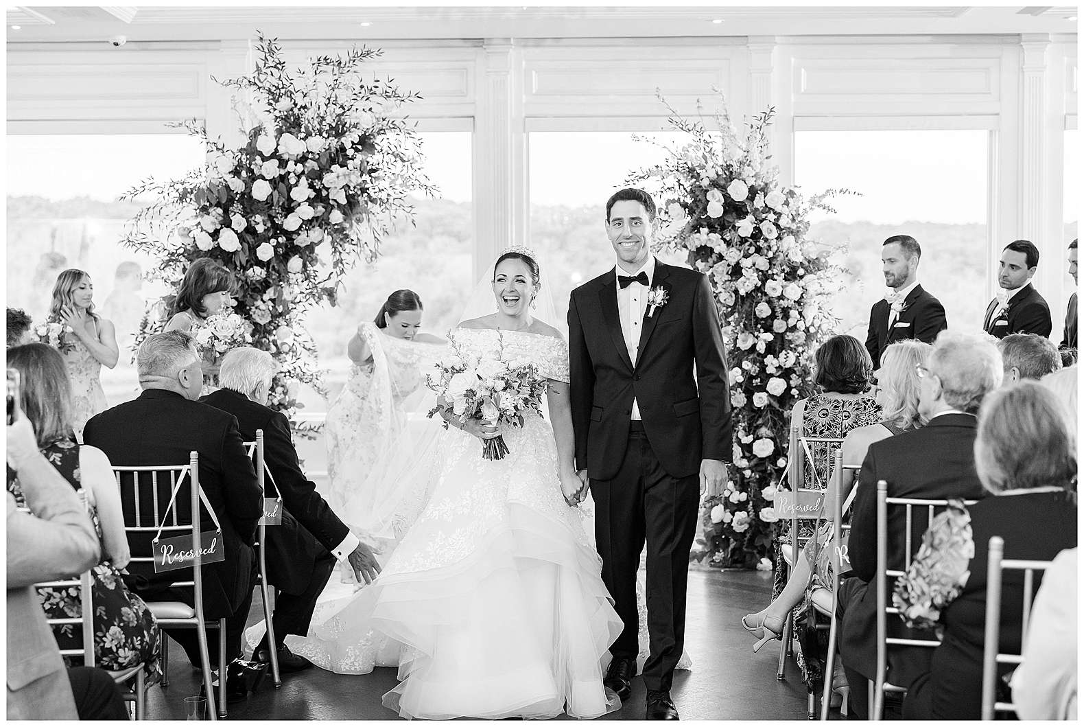 candid photo of bride and groom during ceremony recessional at The Mill Lakeside Manor in Spring Lake, NJ