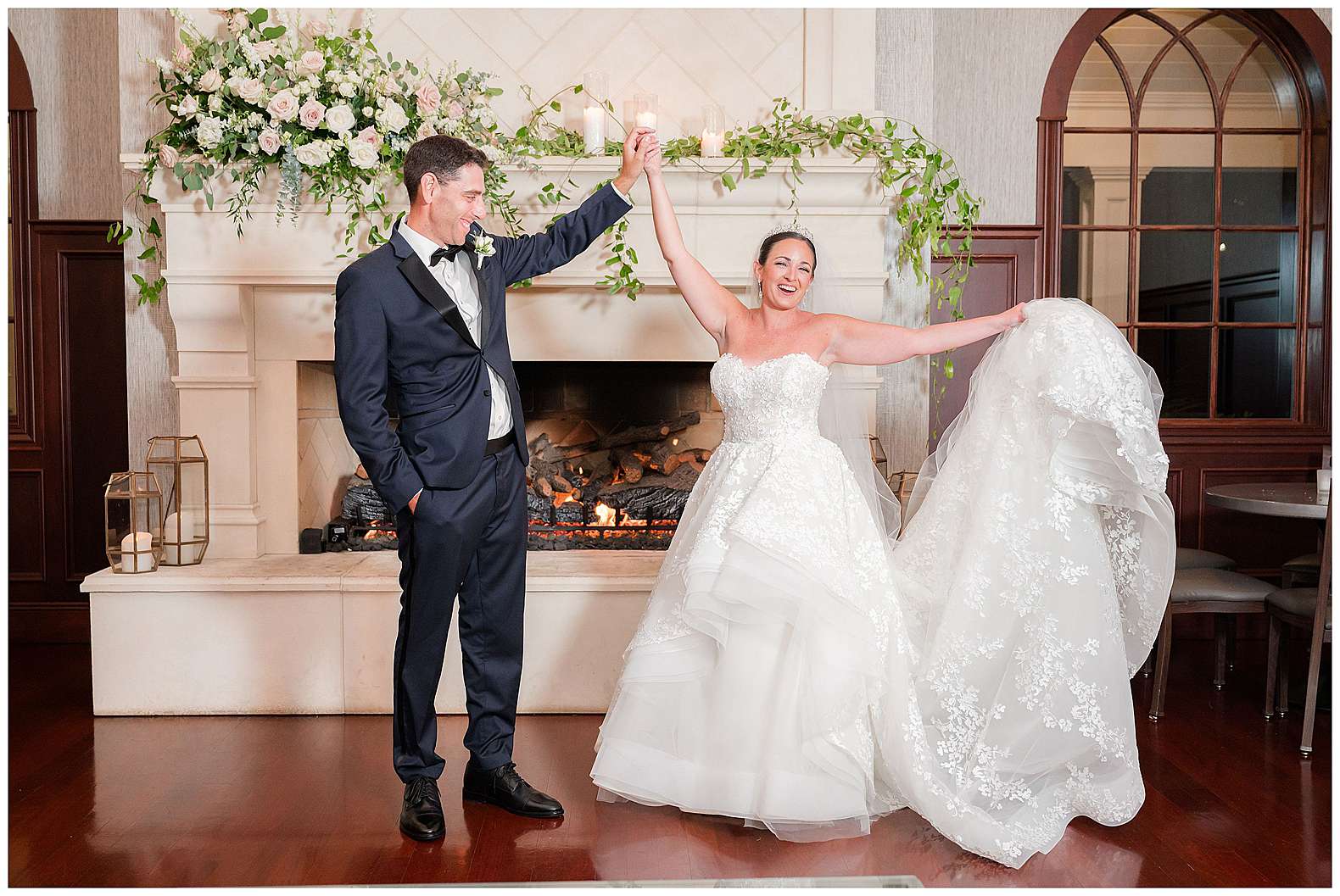 candid photo of bride and groom at the fireplace of The Mill Lakeside Manor in Spring Lake, NJ