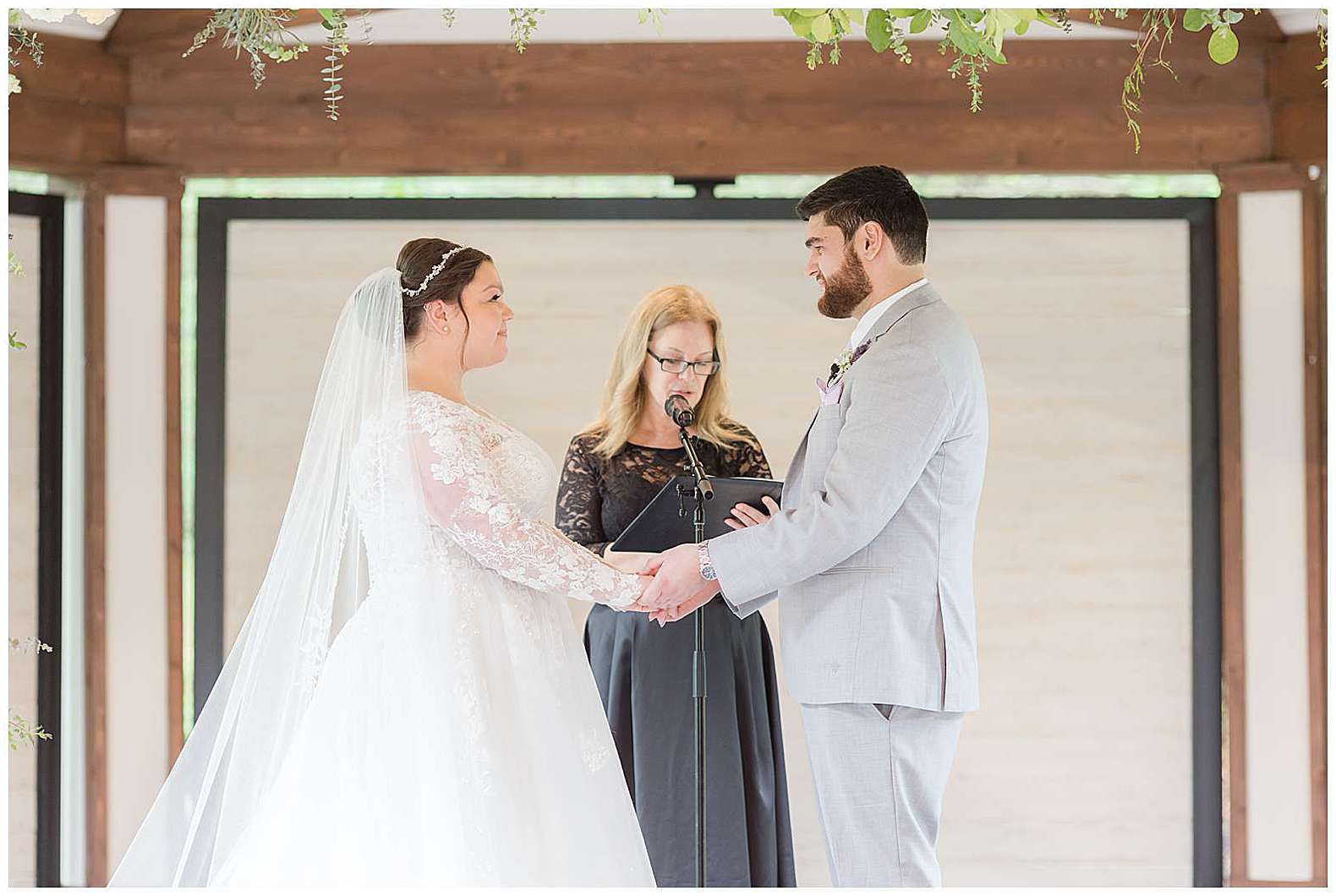 bride and groom exchanging vows at Scotland Run wedding in Williamstown, NJ