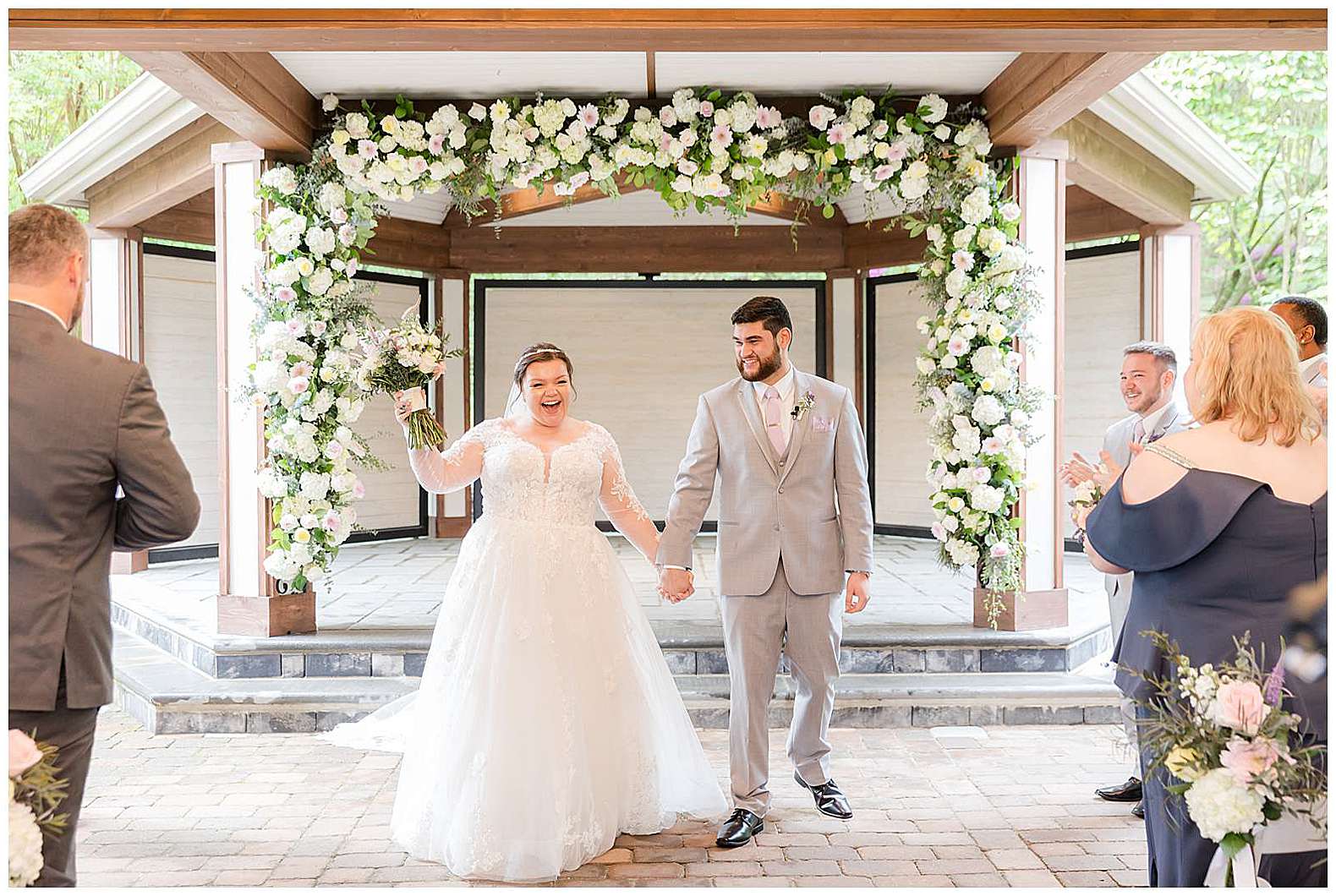 bride and groom recessional at Scotland Run wedding in Williamstown, NJ