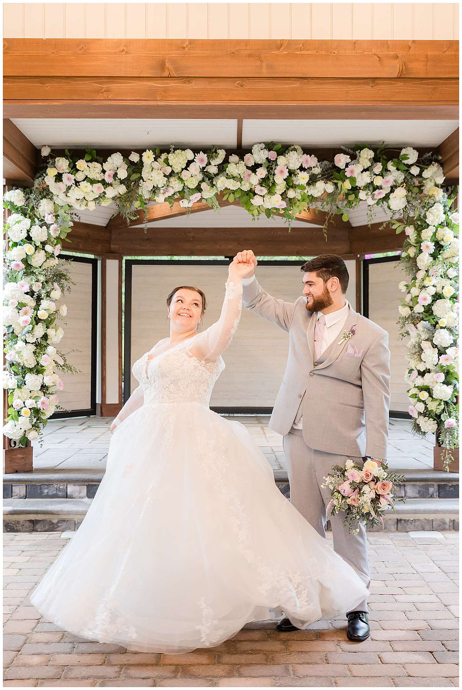 groom twirling his bride during Scotland Run wedding in Williamstown, NJ