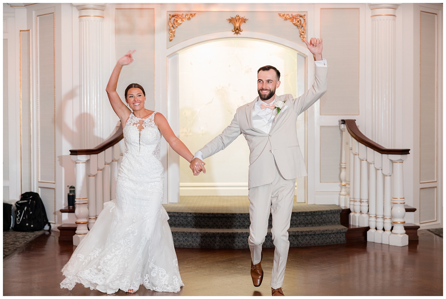 bride and groom entering the ballroom