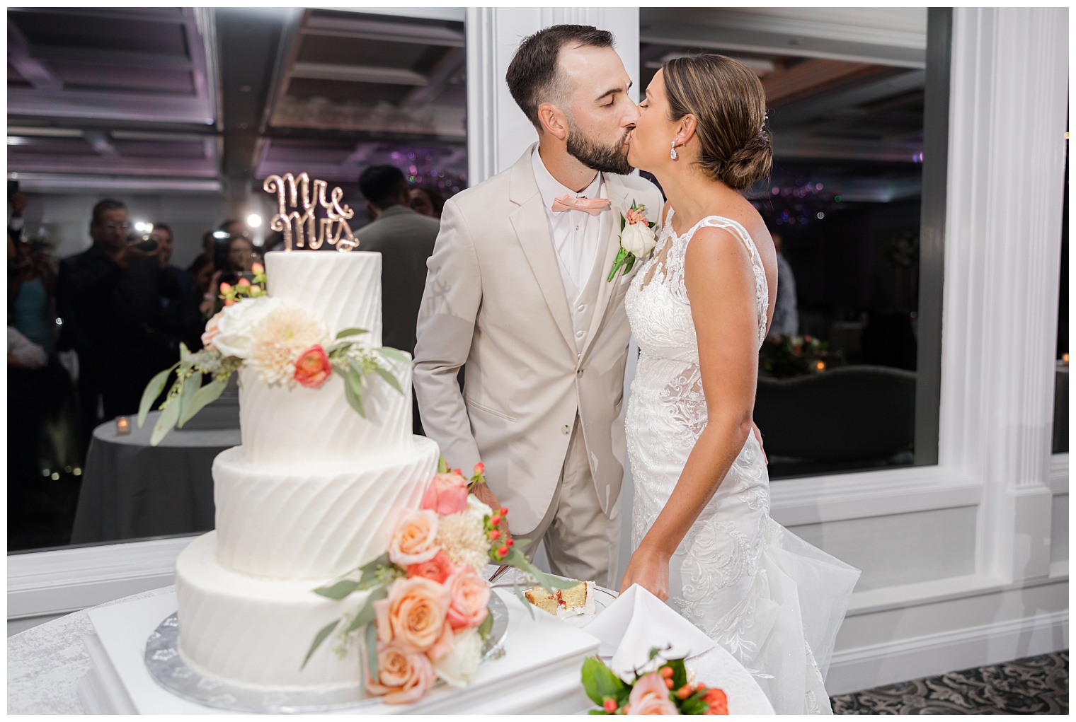 bride and groom cutting the wedding cake