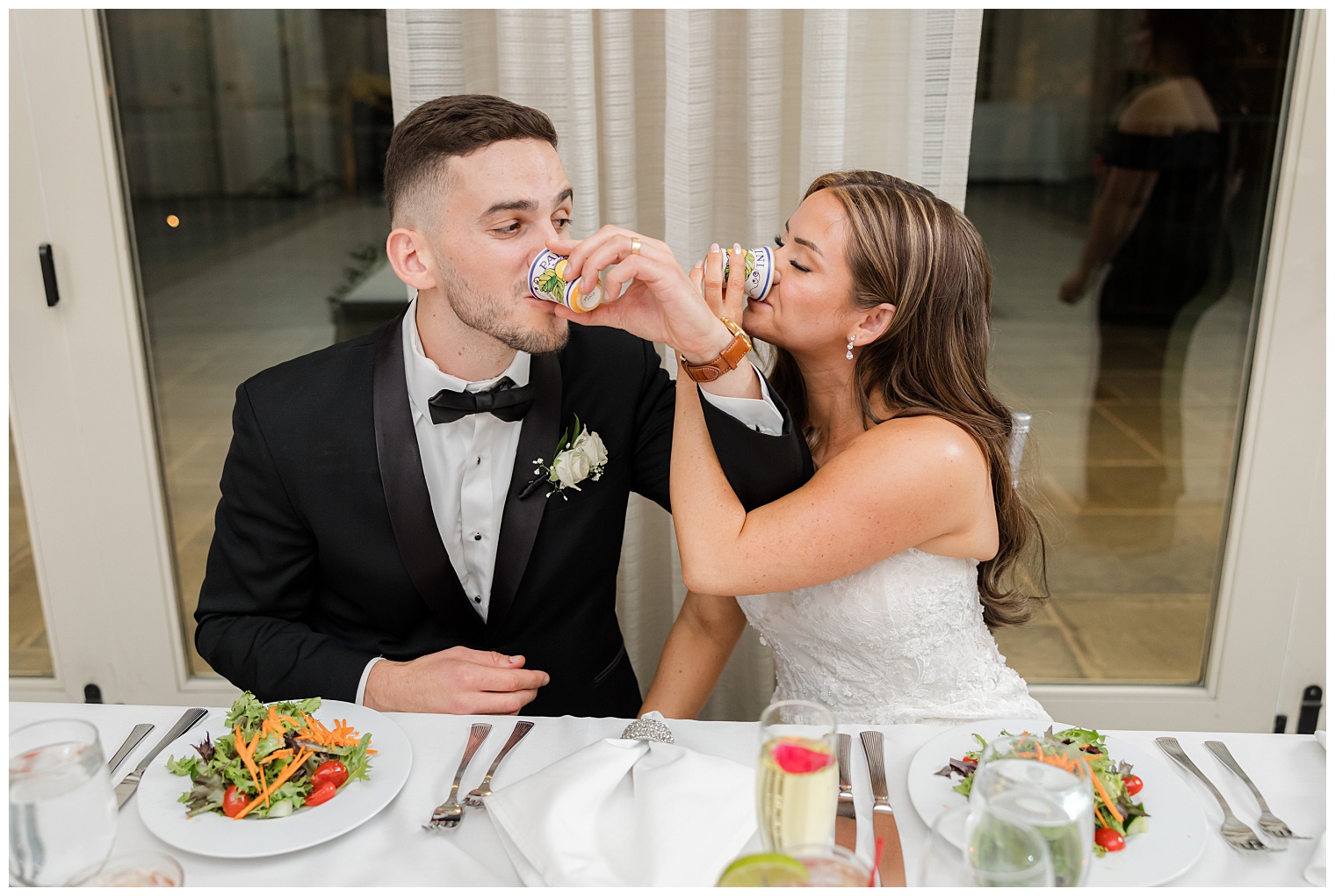 bride and groom toasting