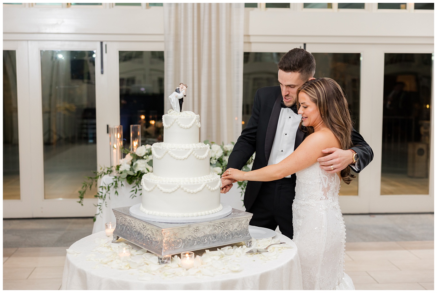 bride and groom cutting the cake