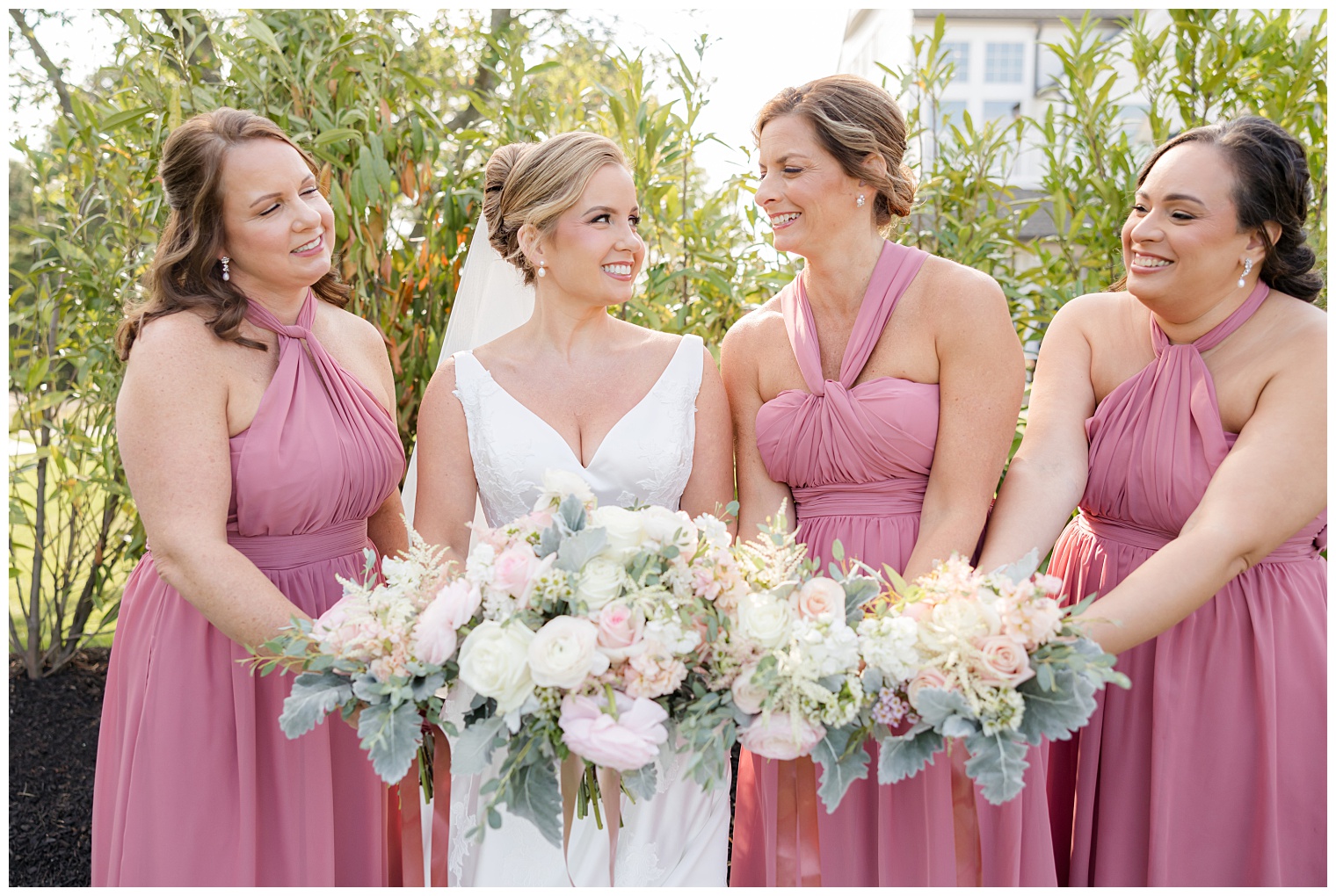 bride with her bridesmaids