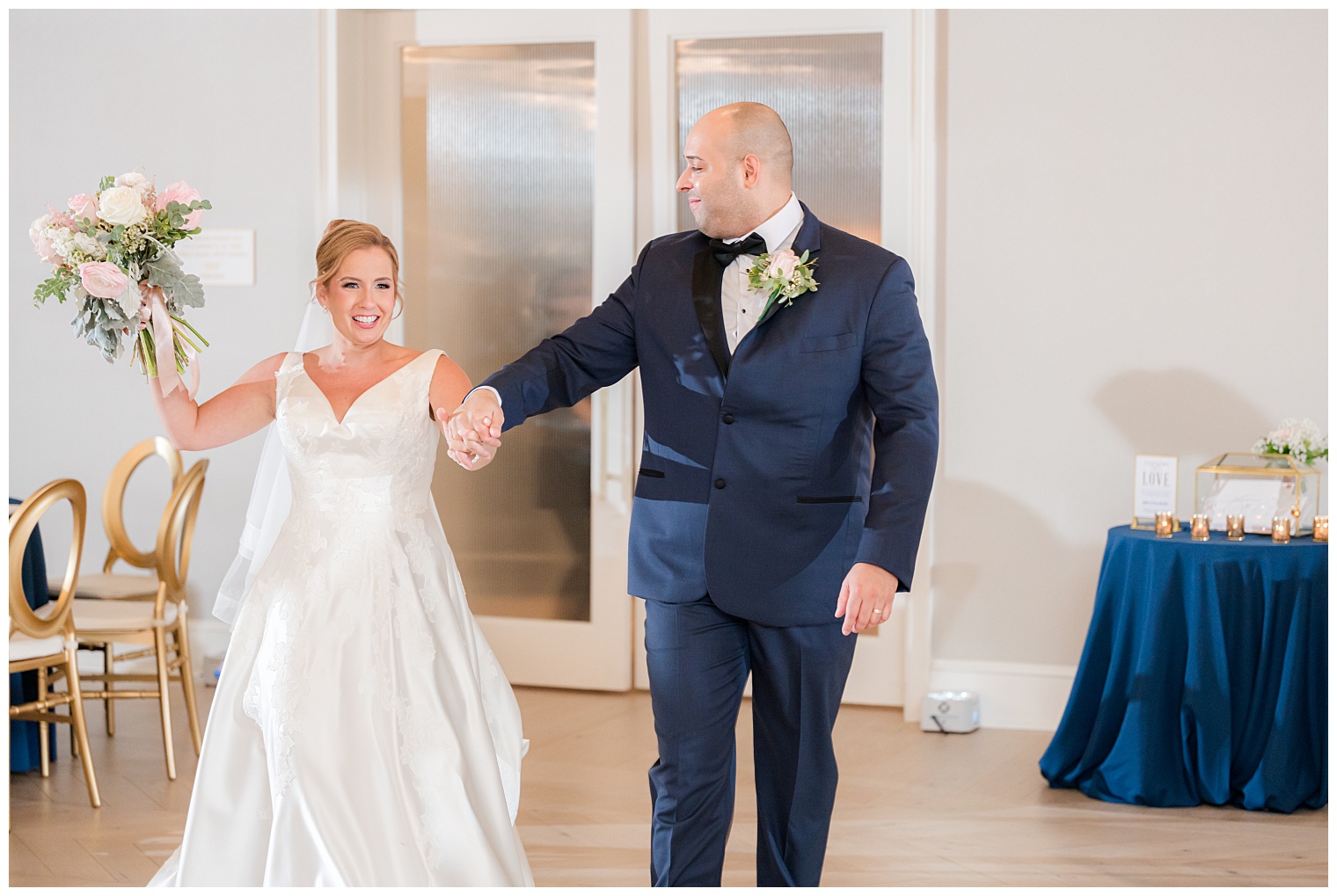 bride and groom entering to the ballroom