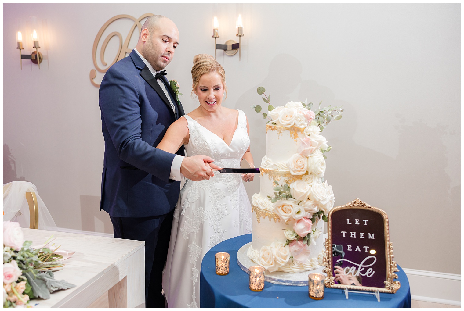 bride and groom cutting the wedding cake