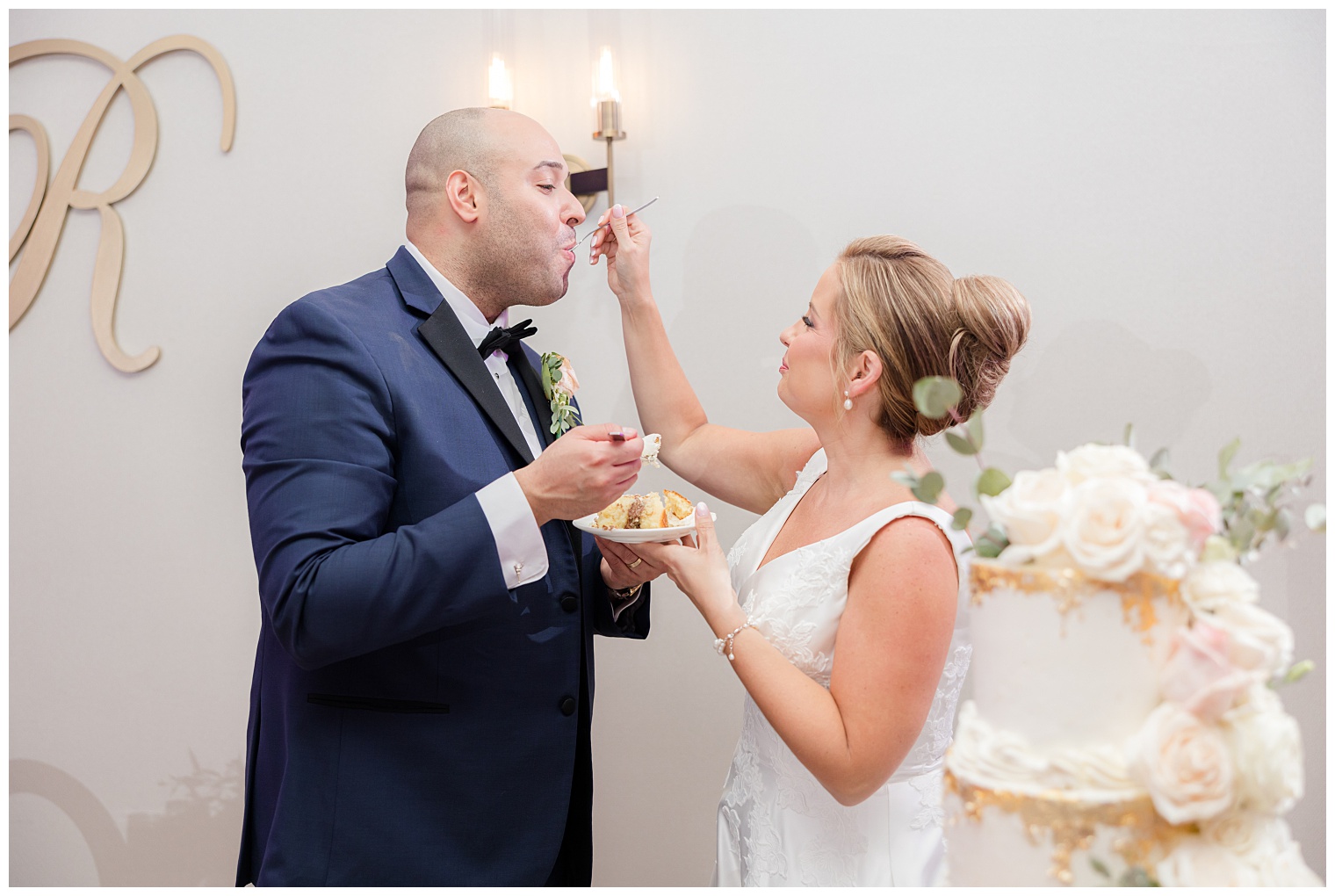 bride and groom cutting the wedding cake
