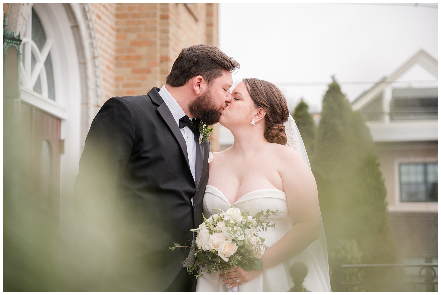 bride and groom kissing