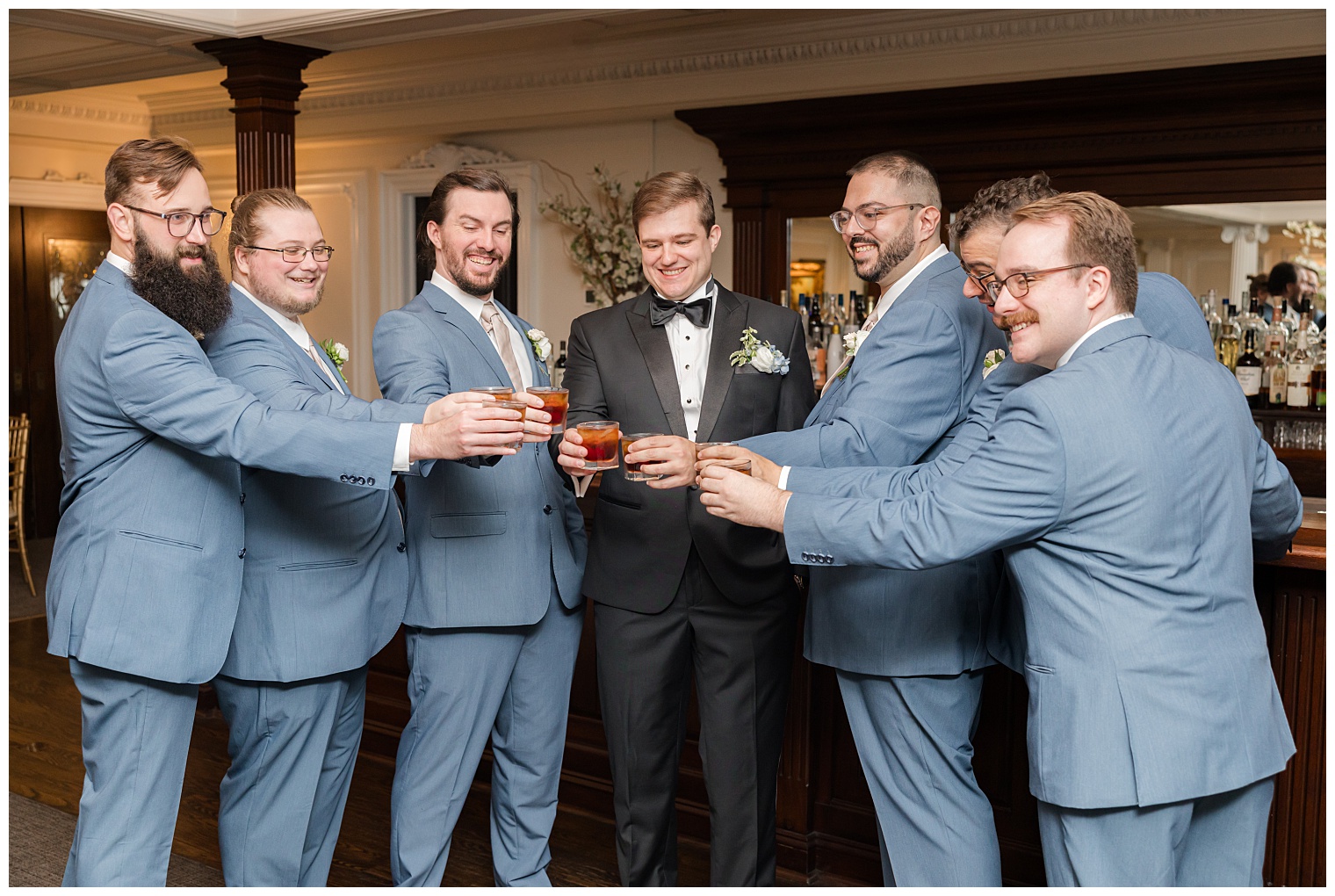 groom celebrating with his groomsmen