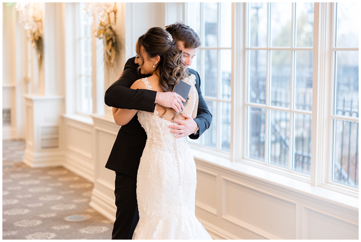 bride and groom hugging