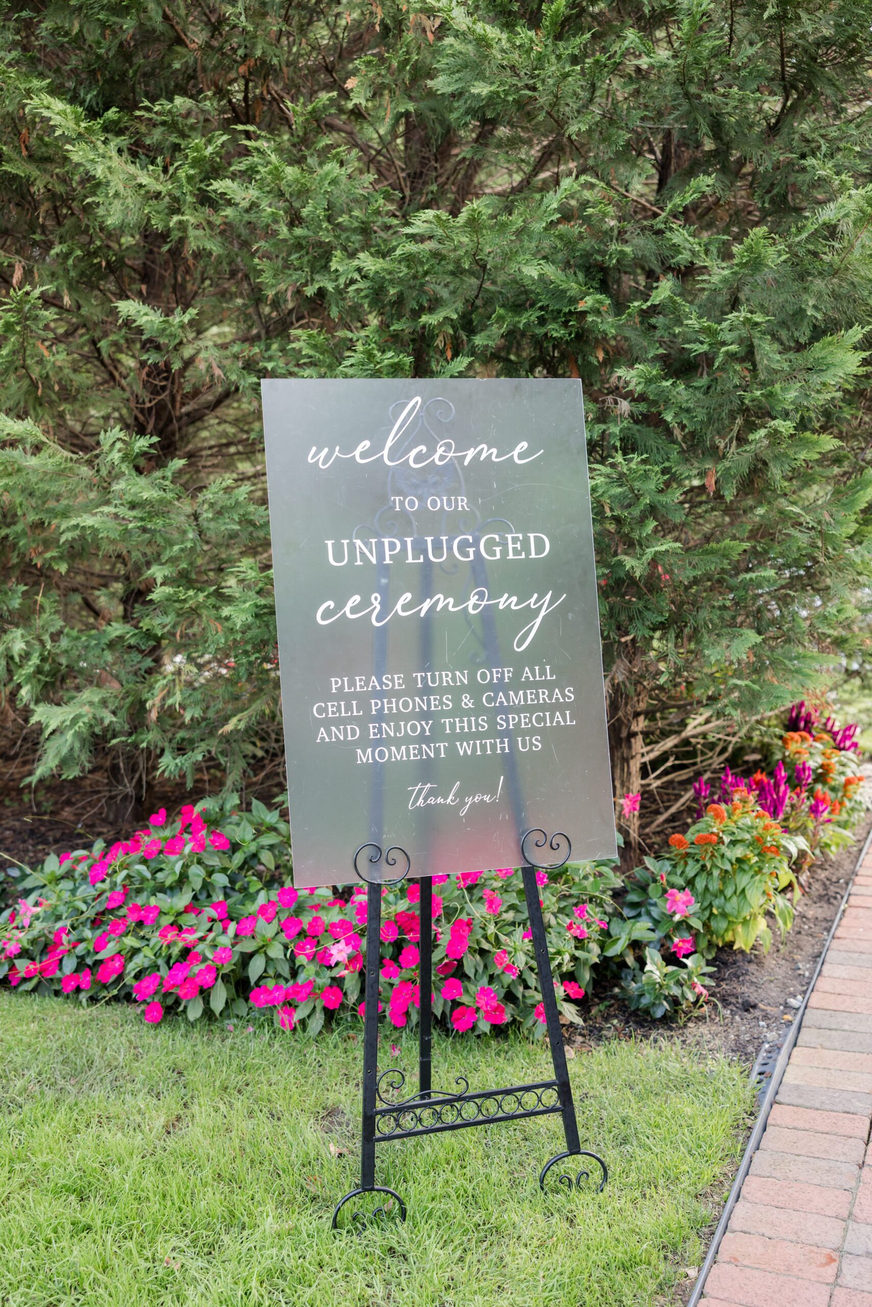 Elegant sign welcomes guests to an unplugged ceremony, inviting them to be fully present in the moment