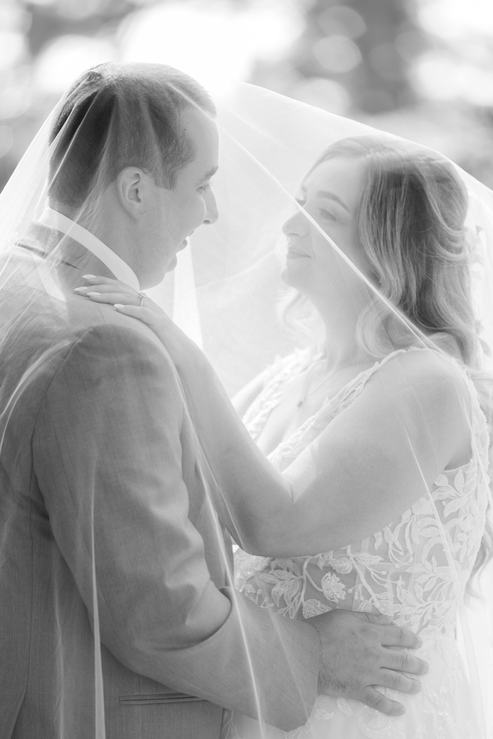Black and white portrait of Katherine and Henry under the bride’s veil