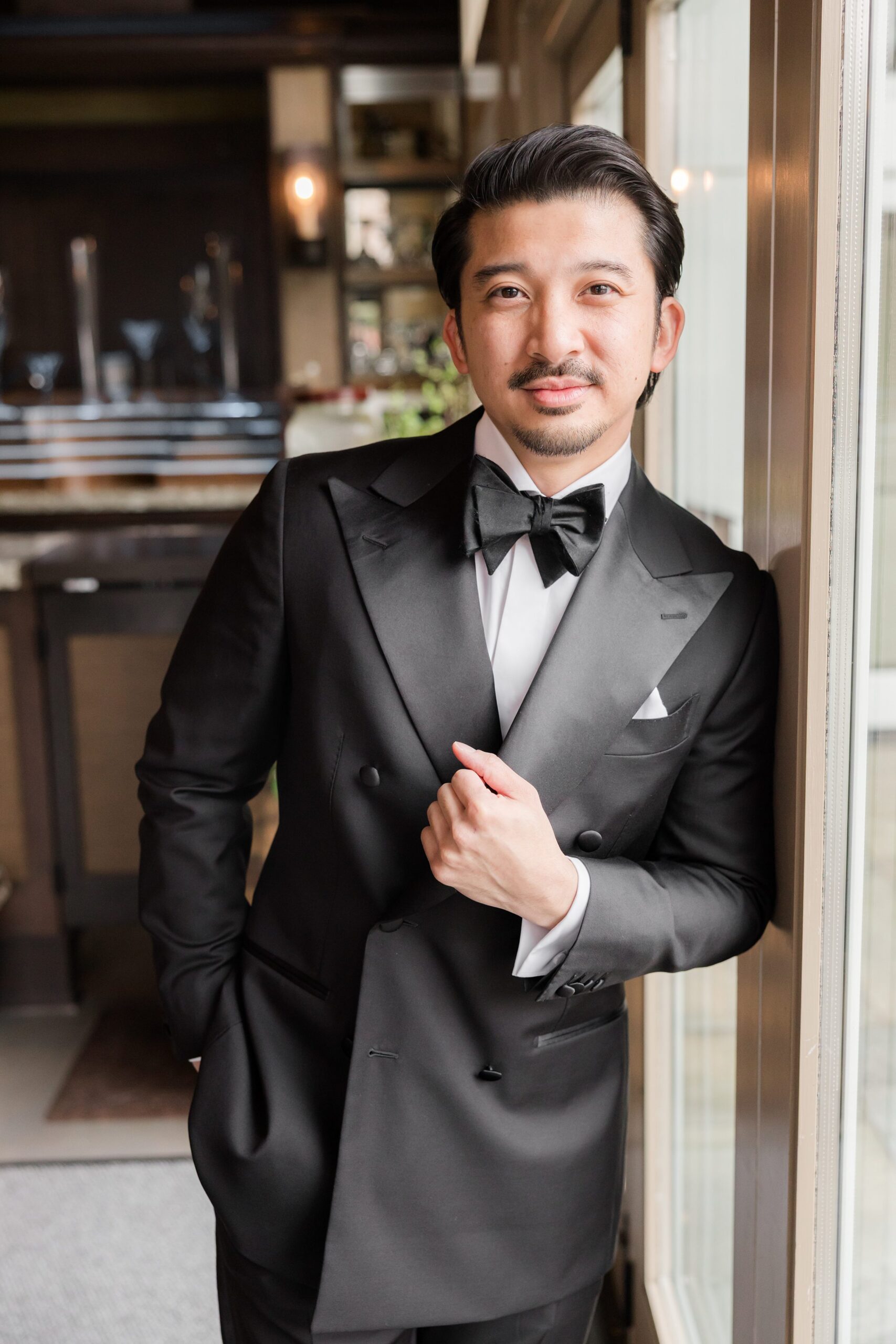 Groom exudes timeless elegance and anticipation for the moment he’ll see his bride