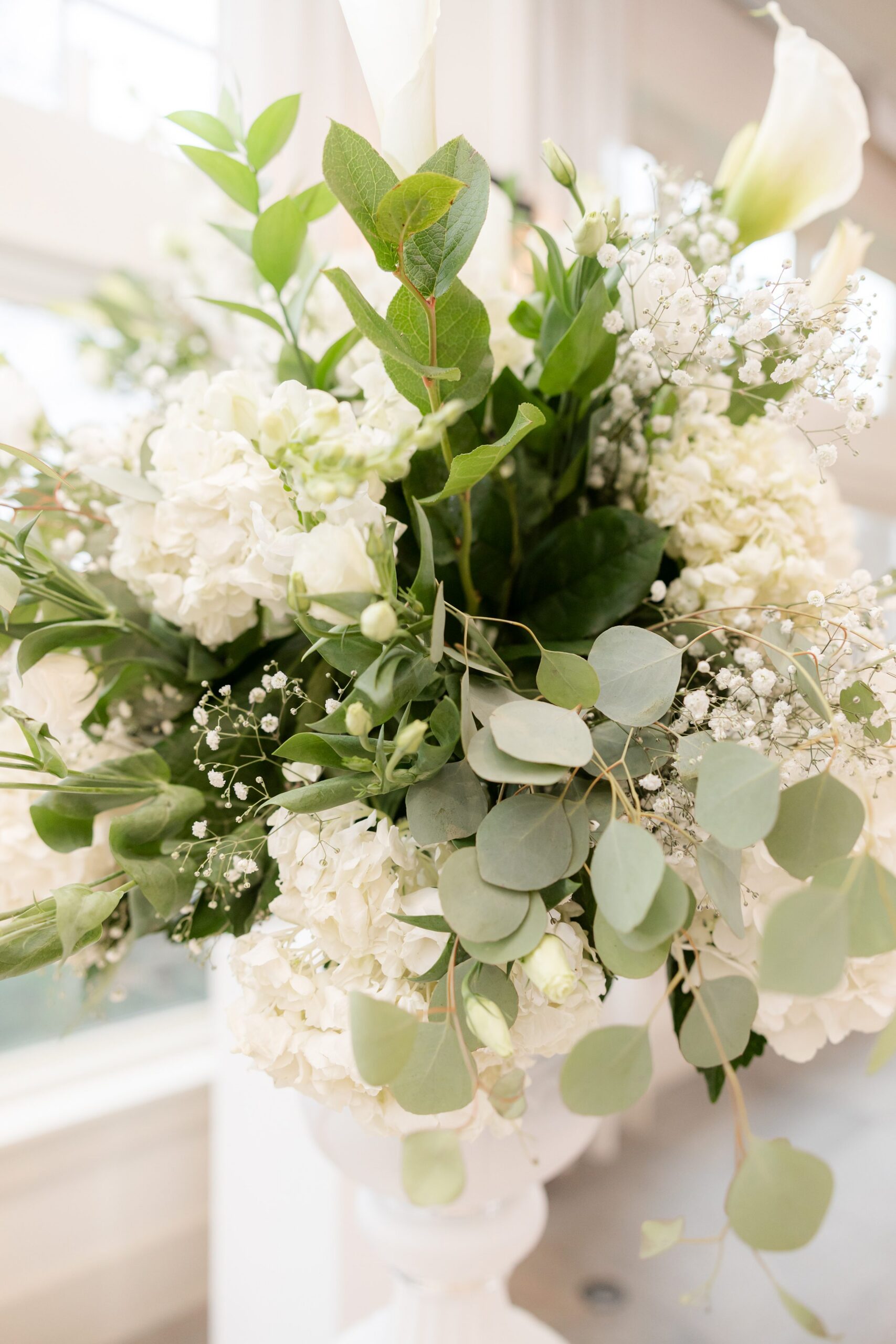 Romantic bouquet of white blooms and greenery, symbolizing purity, love, and new beginnings