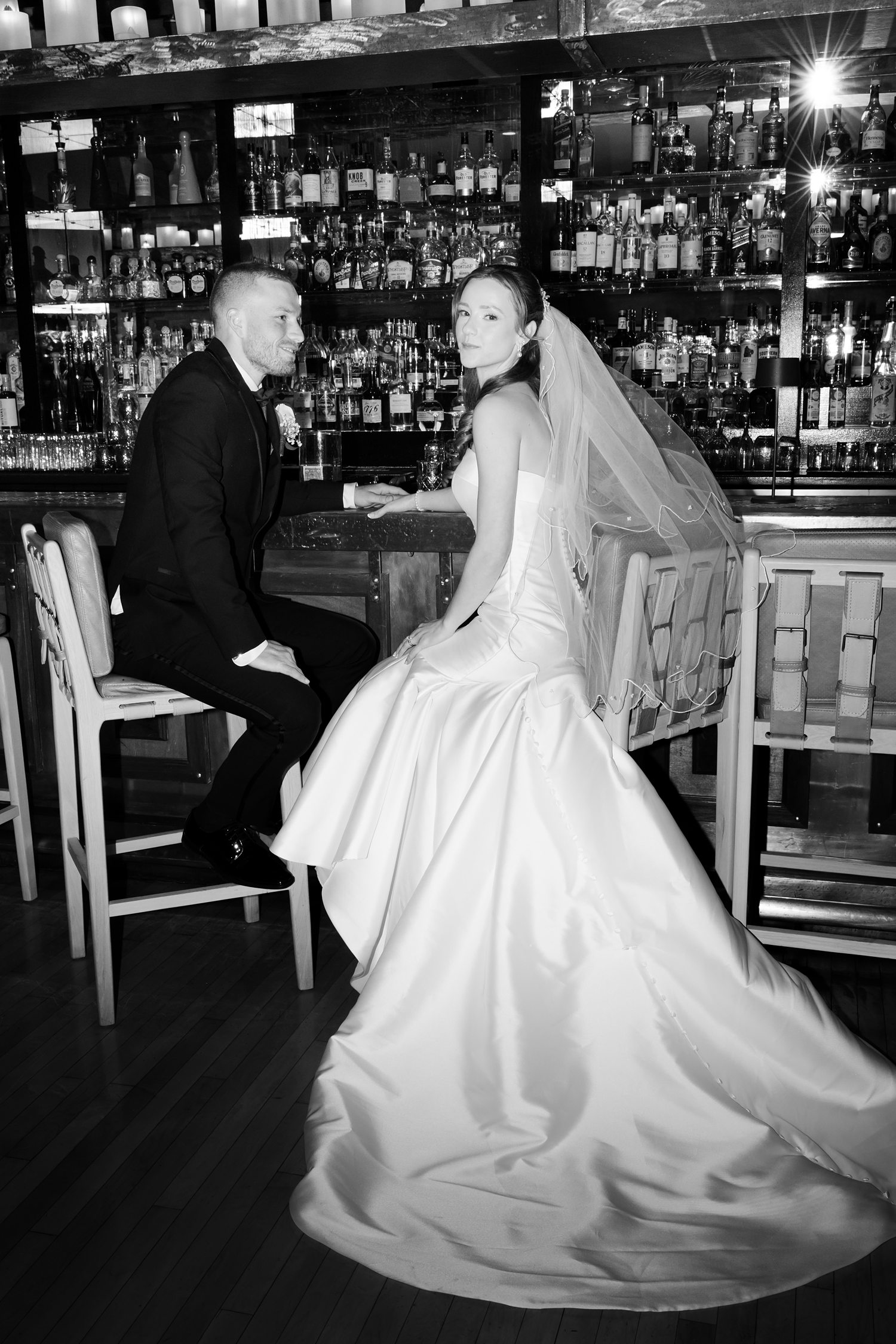 Black and white bridal portrait at elegant bar lounge