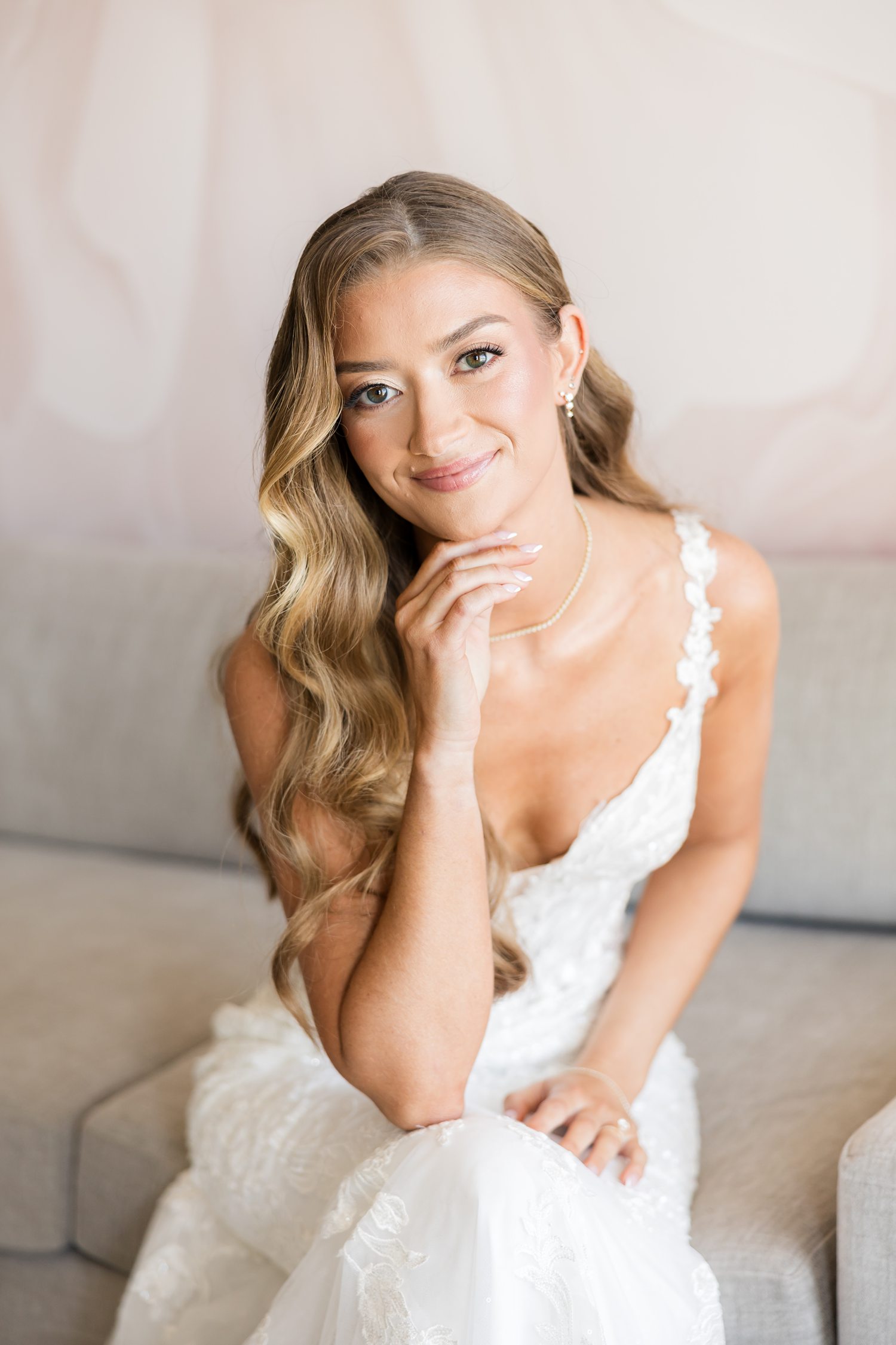 Romantic bridal portrait with soft curls and elegant wedding makeup