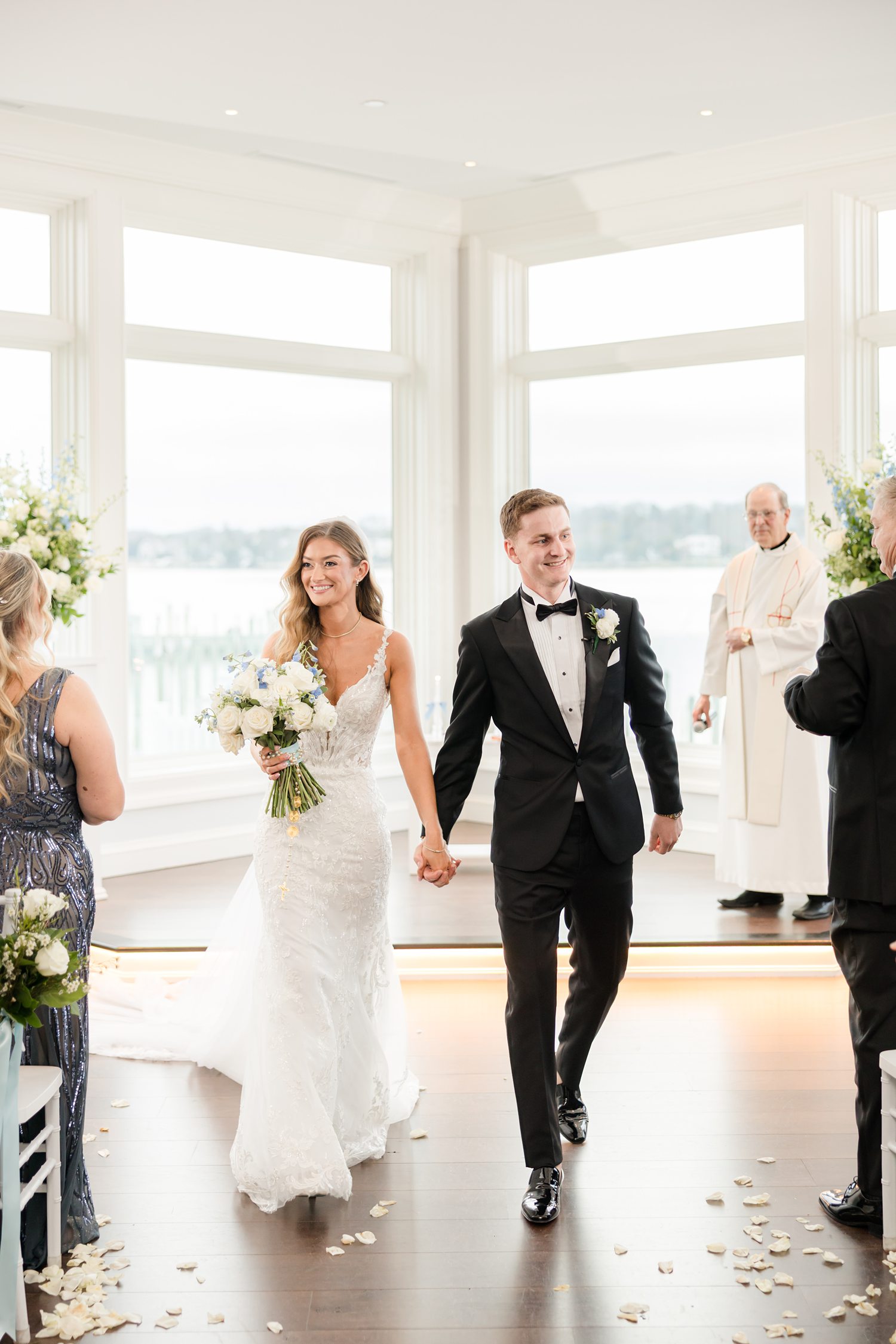 Bride and groom walking hand in hand after wedding ceremony celebration