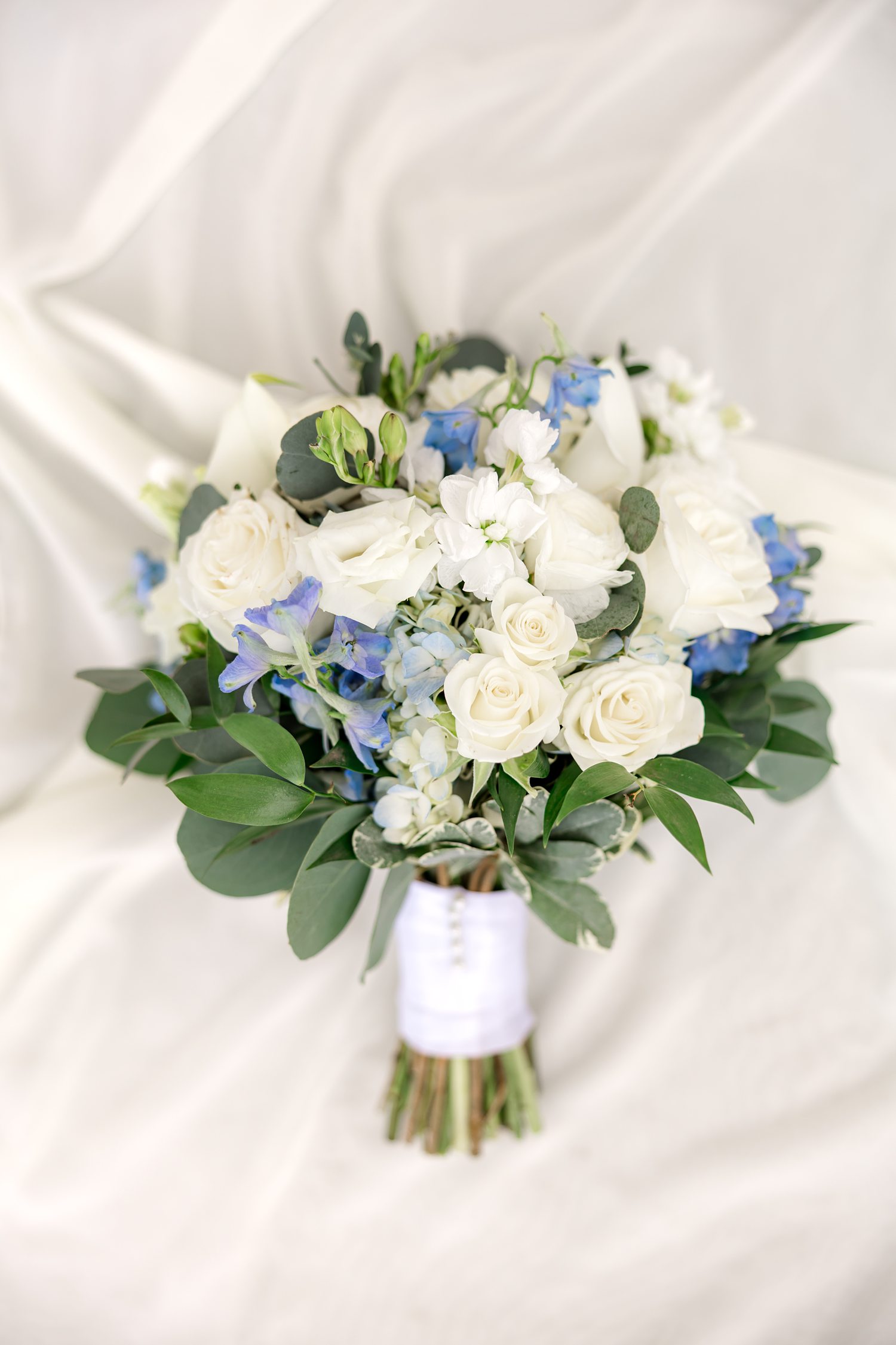 Blue and white bridal bouquet arranged for elegant luxury wedding