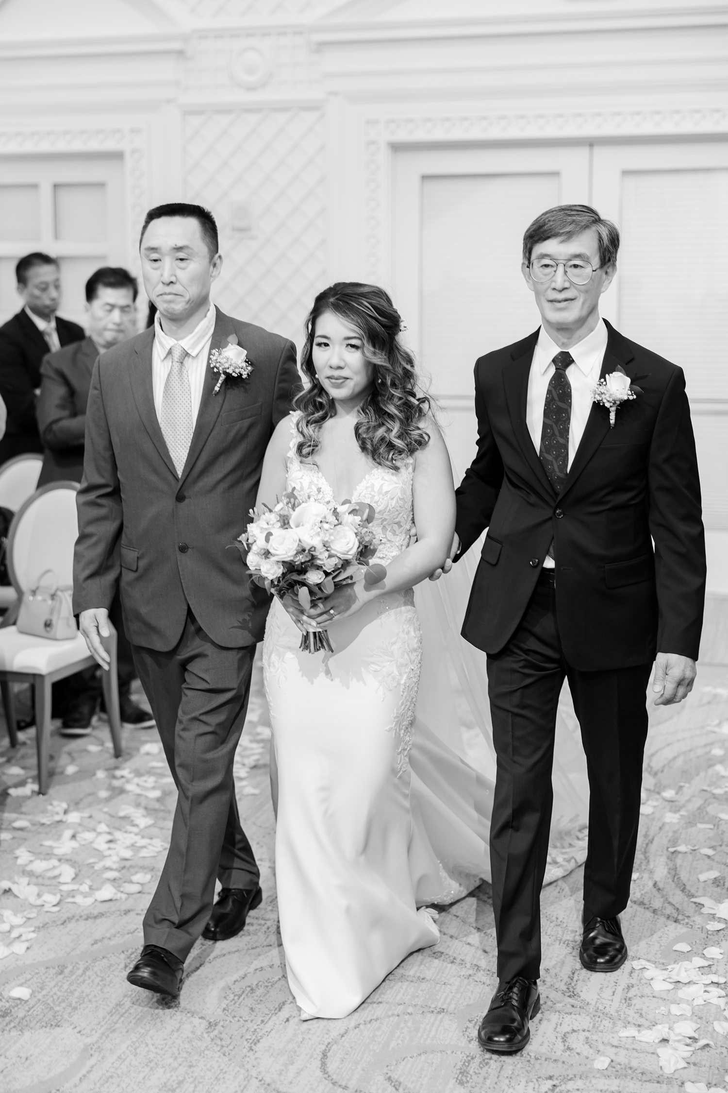 Newlywed bride walking together indoors after elegant wedding ceremony